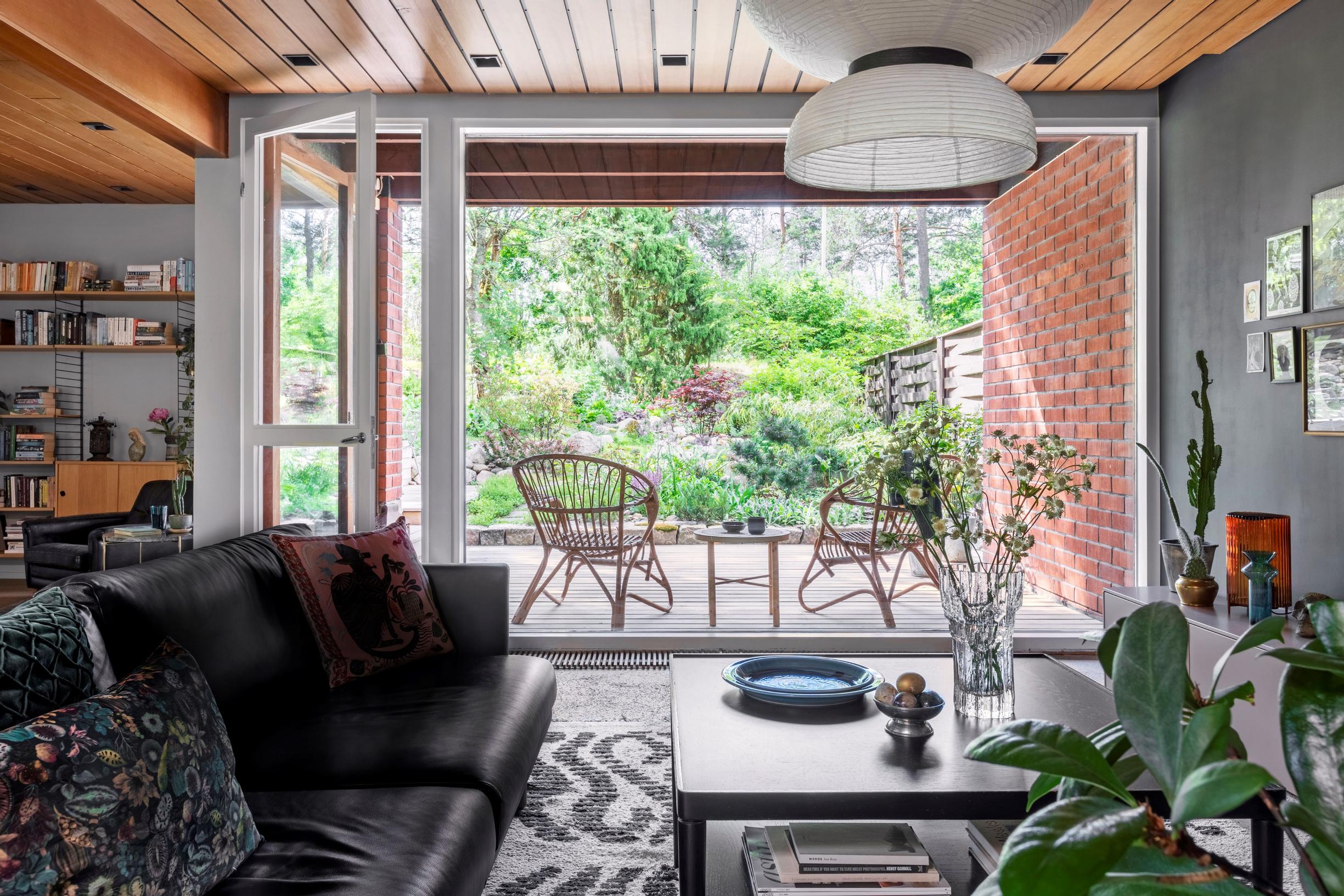 View from the living room’s panoramic window to the backyard and terrace