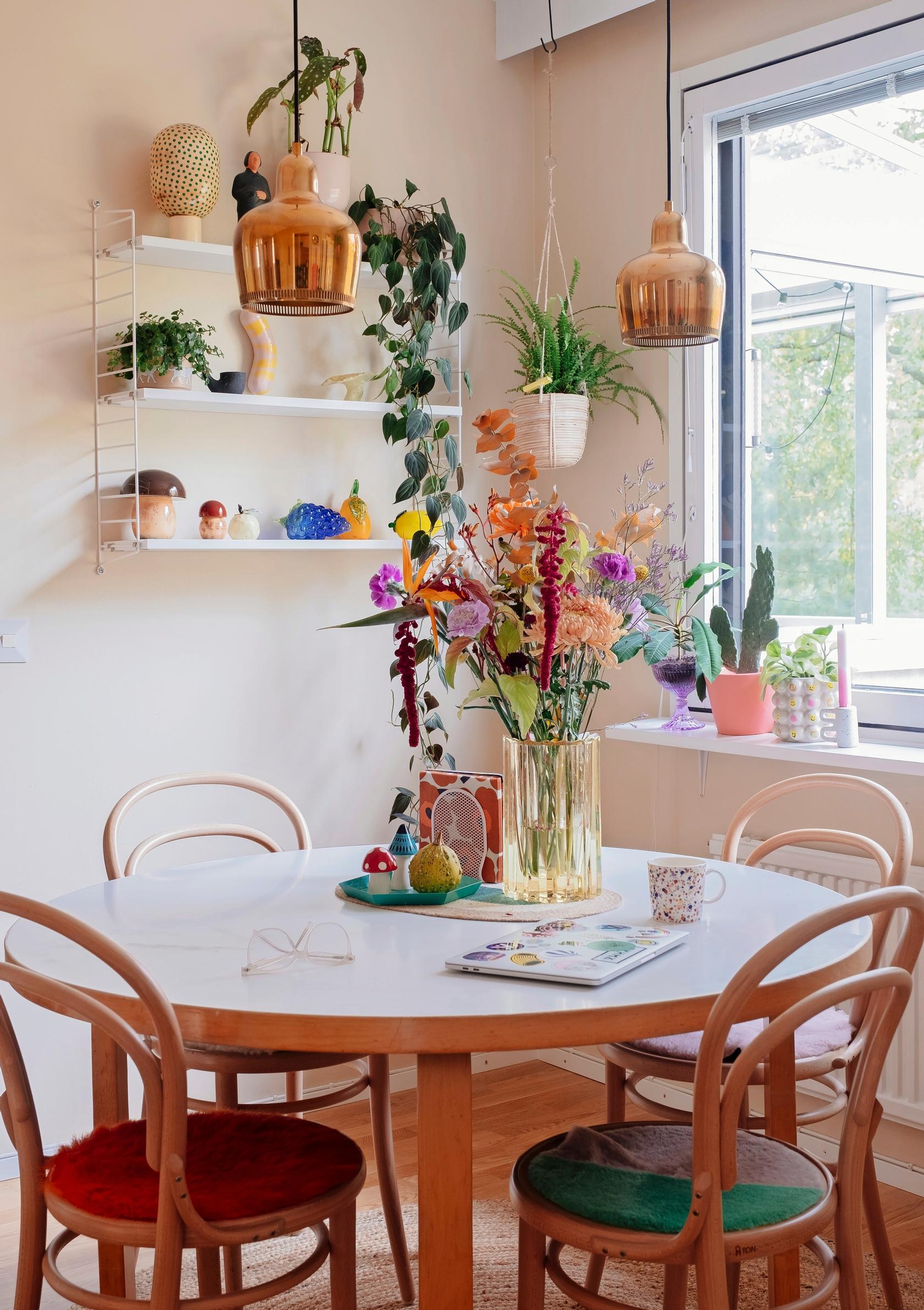 An Artek table paired with Ton chairs