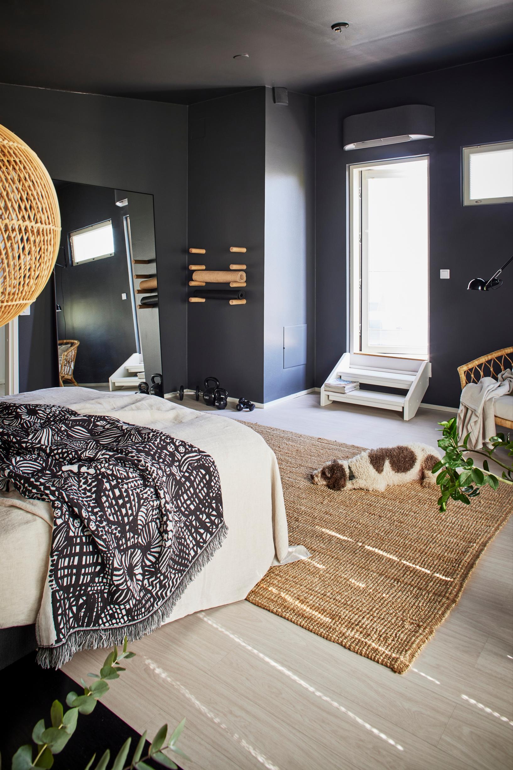 The bedroom was painted graphite gray during the renovation.