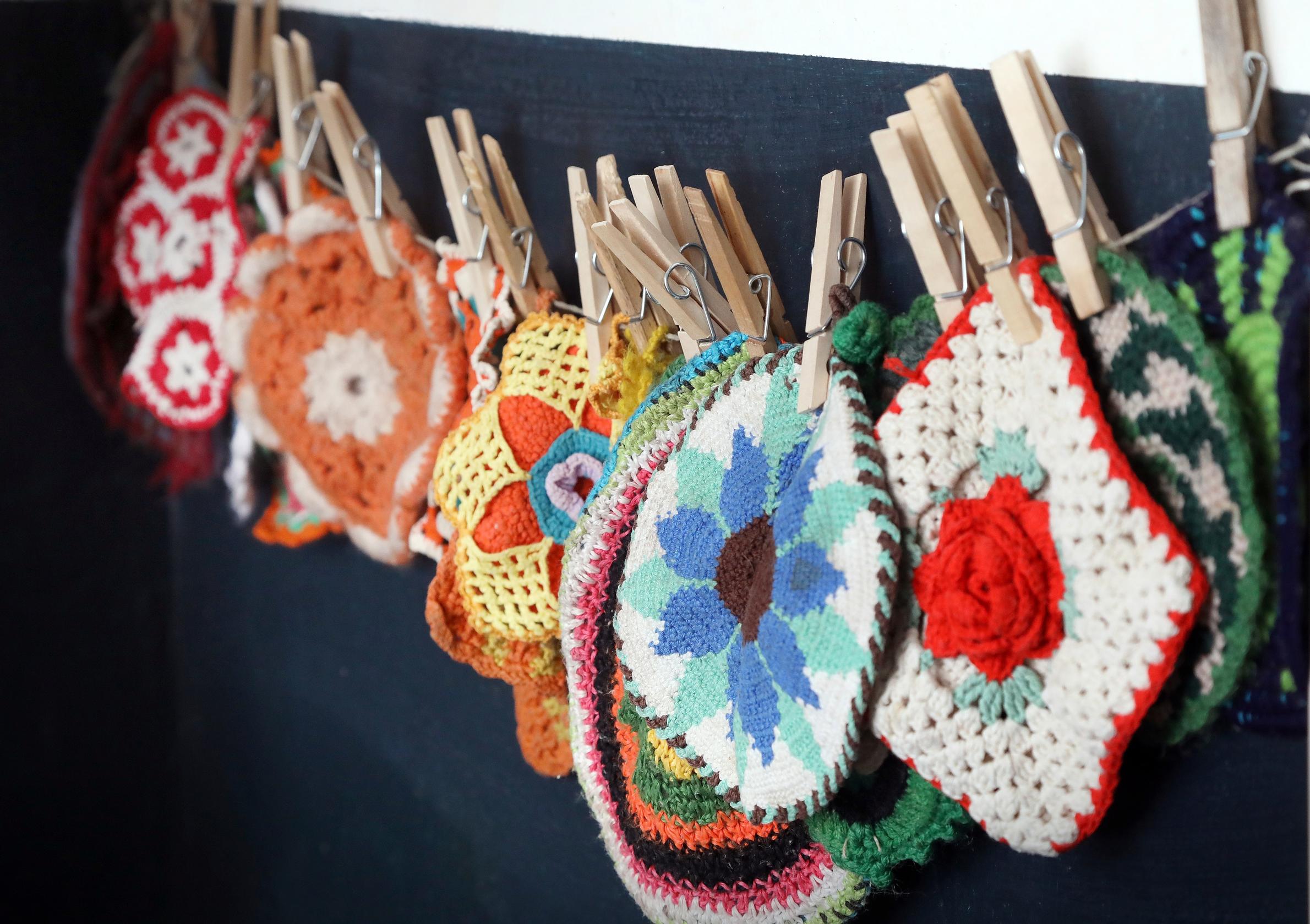 A potholder collection found at a thrift store.