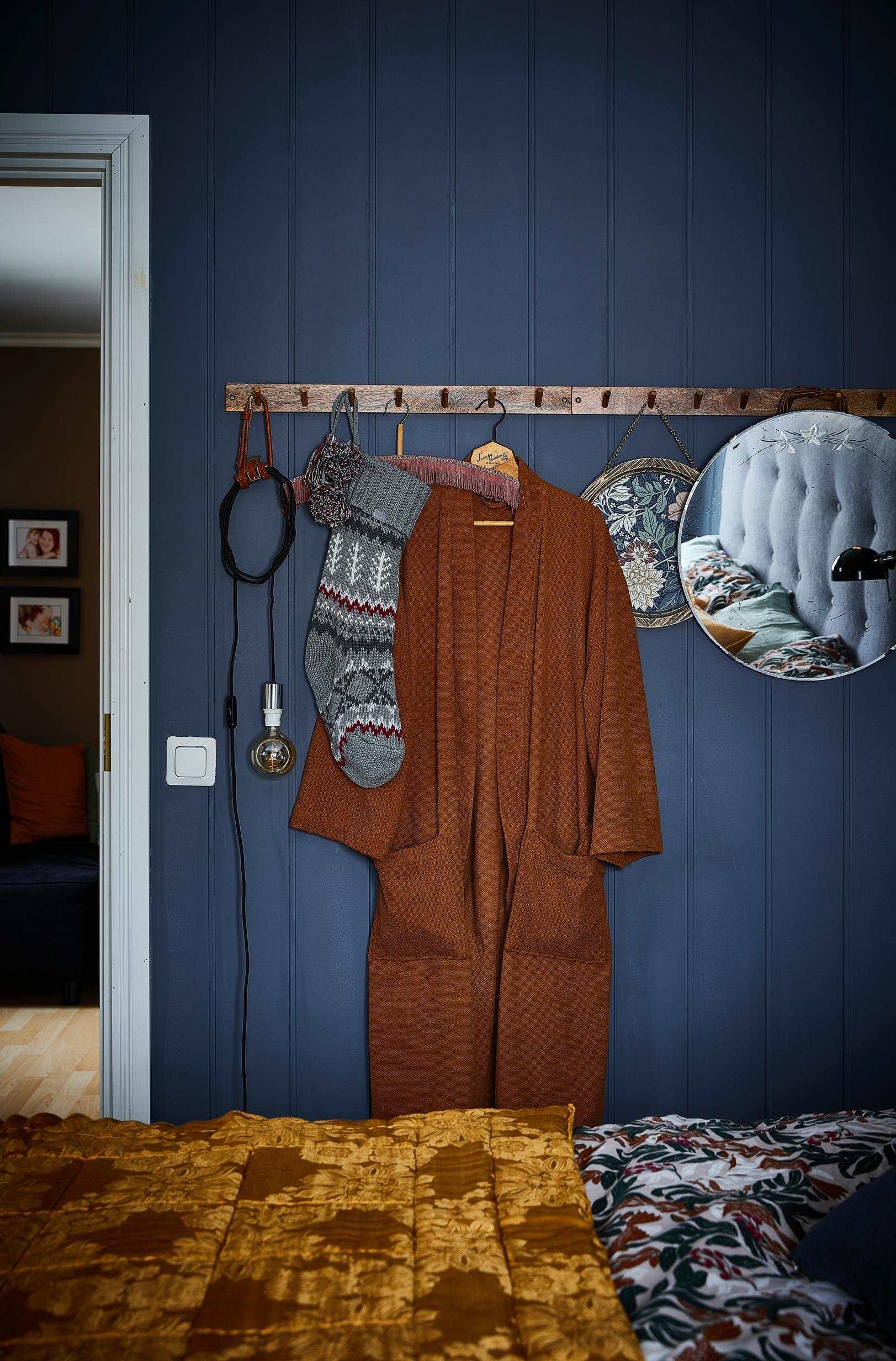 Kirsi’s blue bedroom with a yellow quilt