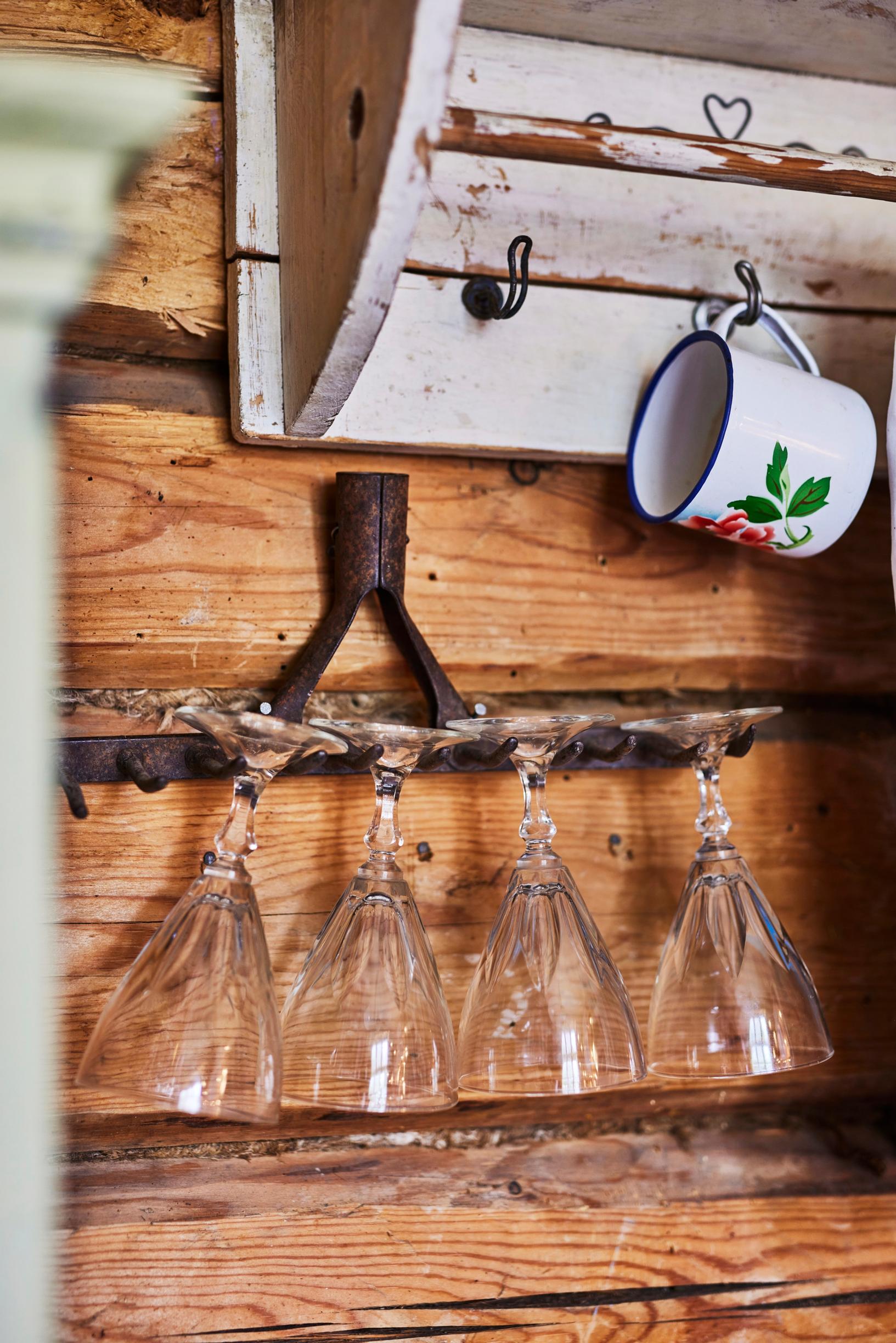 Wine glasses in a rack made from a rake