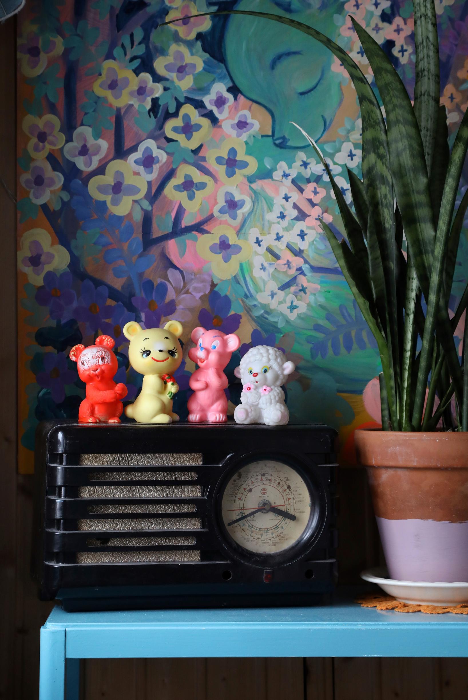 An old radio and a collection of rubber toys.