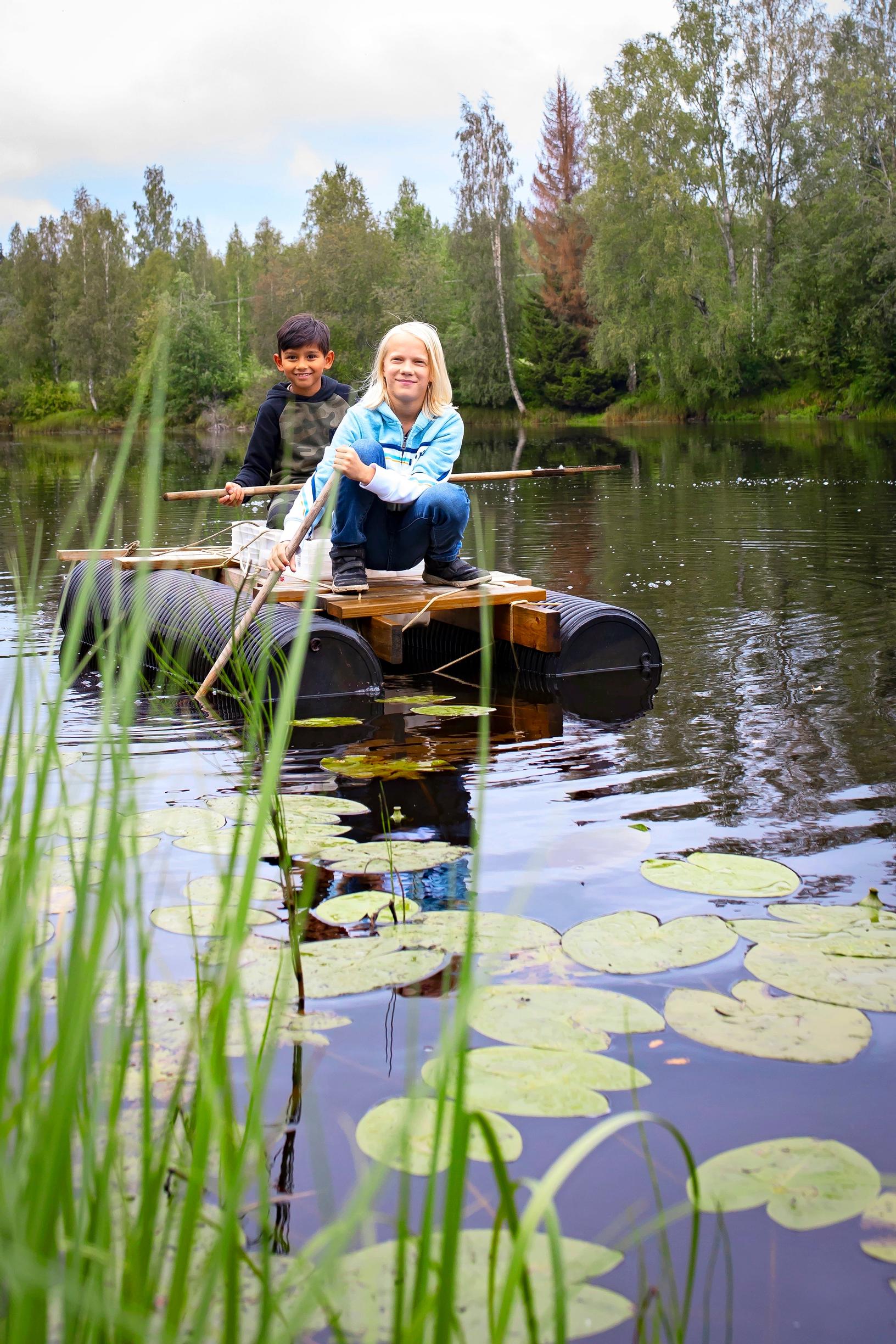Children rowing on a raft