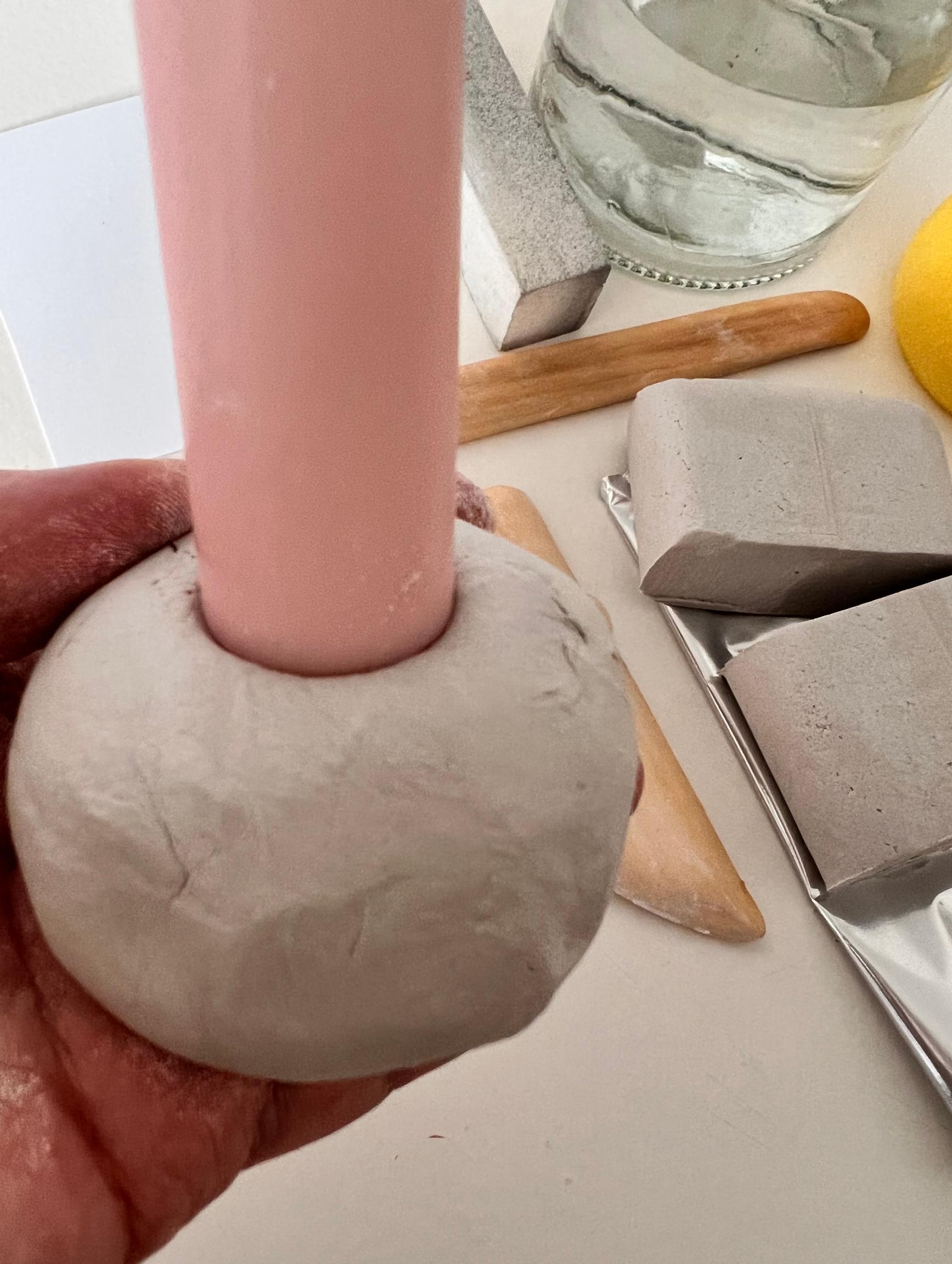 A candle is pushed into the ball.