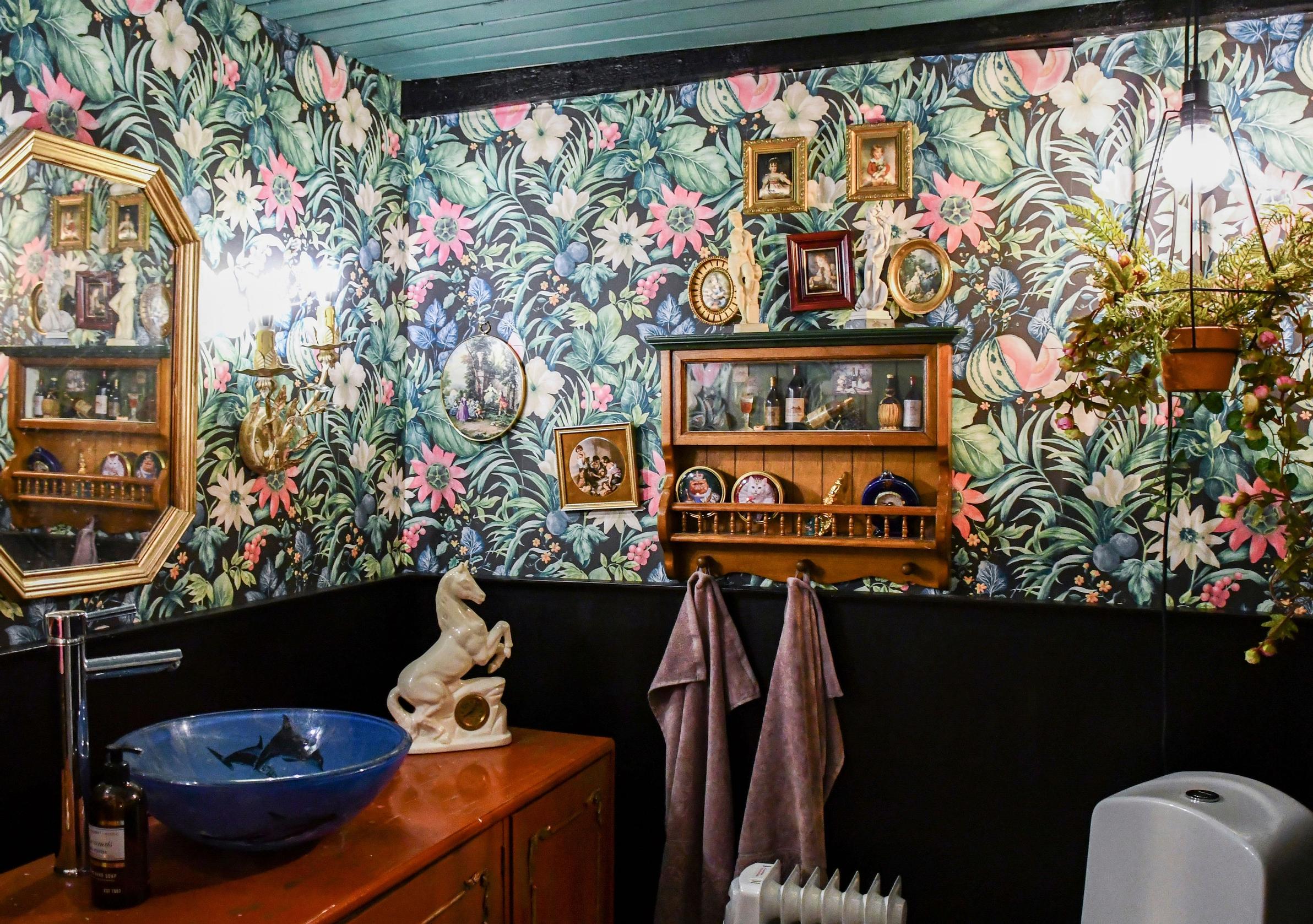 A dark and museum-style bathroom.