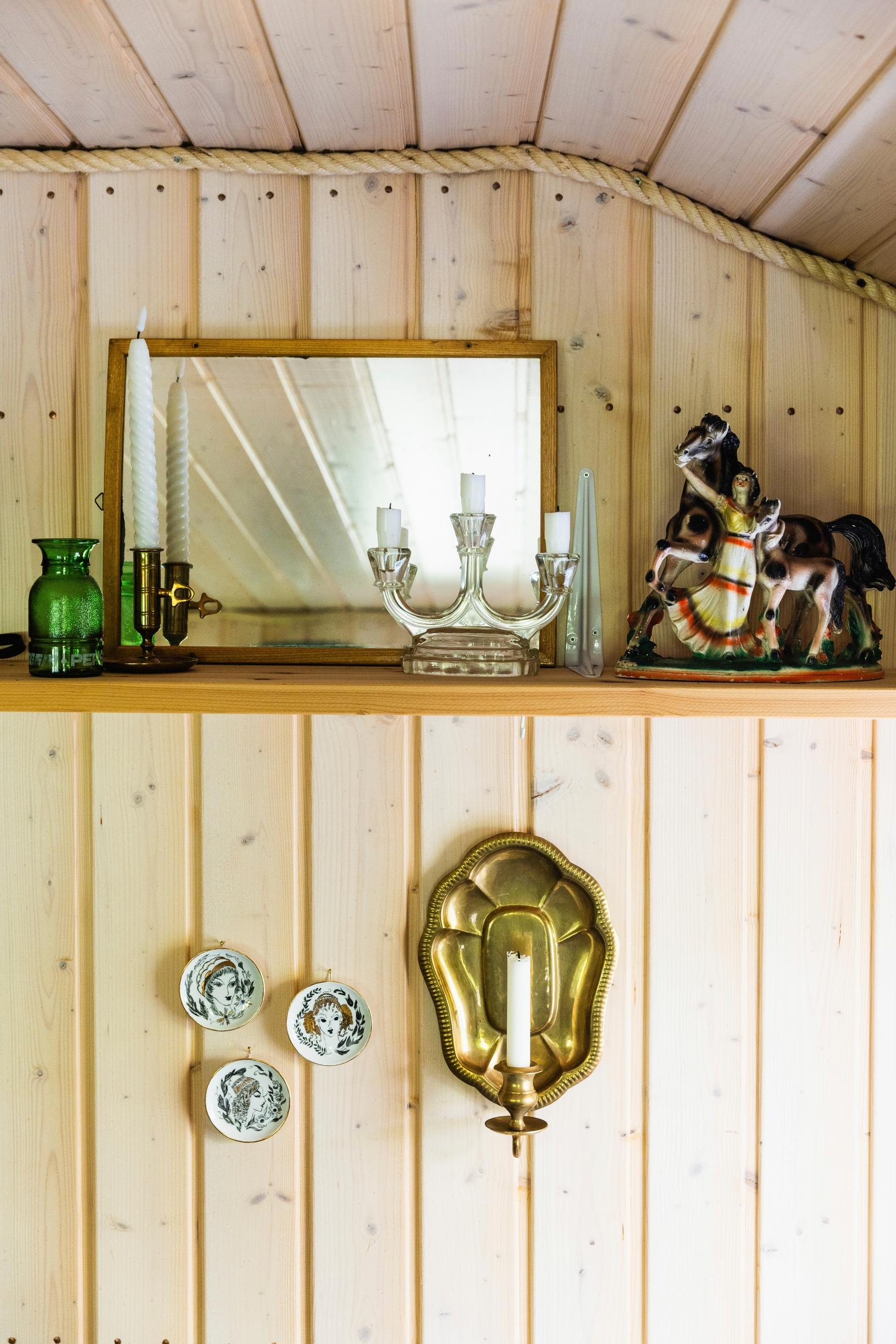 a shelf, mirror, and vintage items