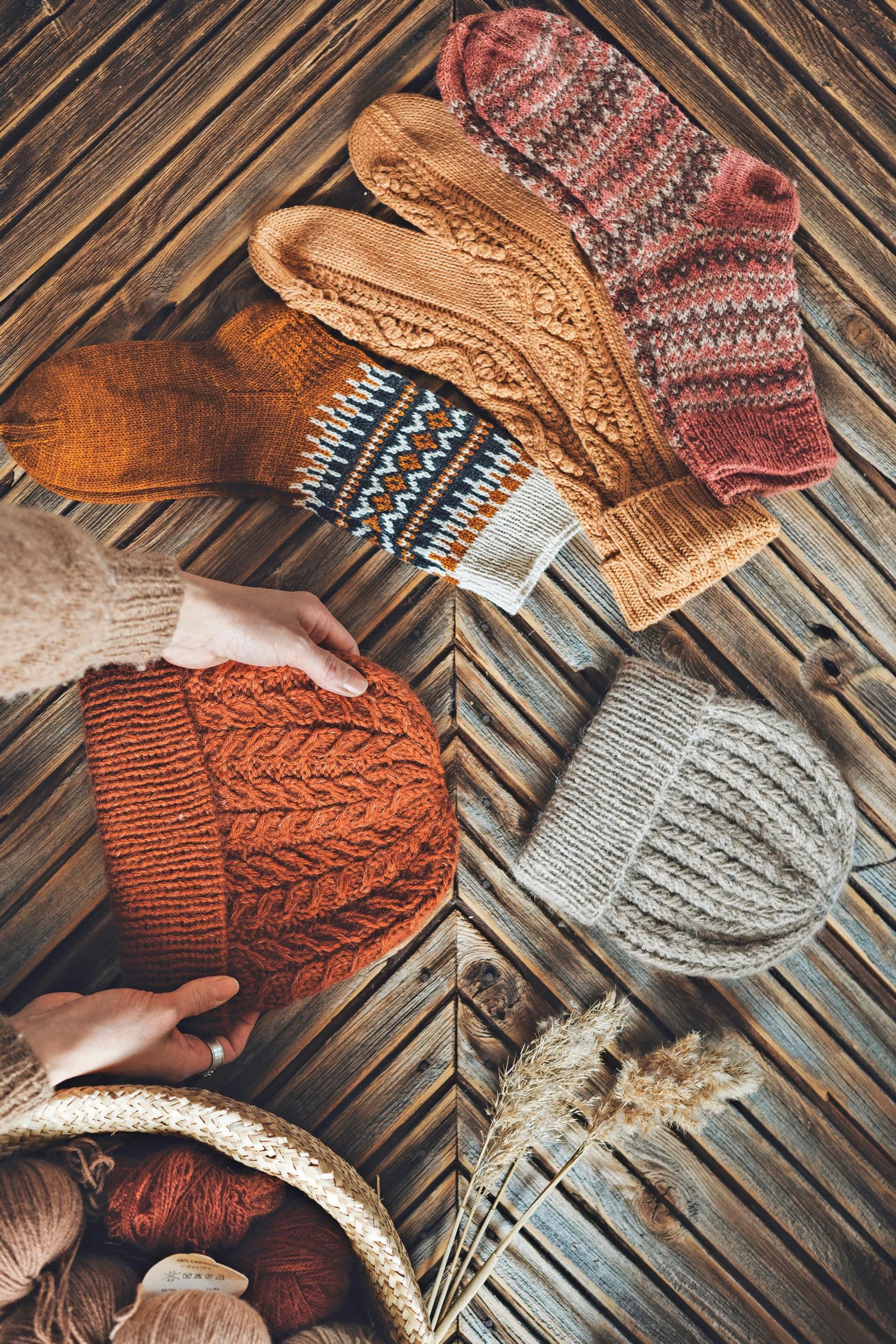 Here you can see a rust-colored and a gray hat, along with wool socks.