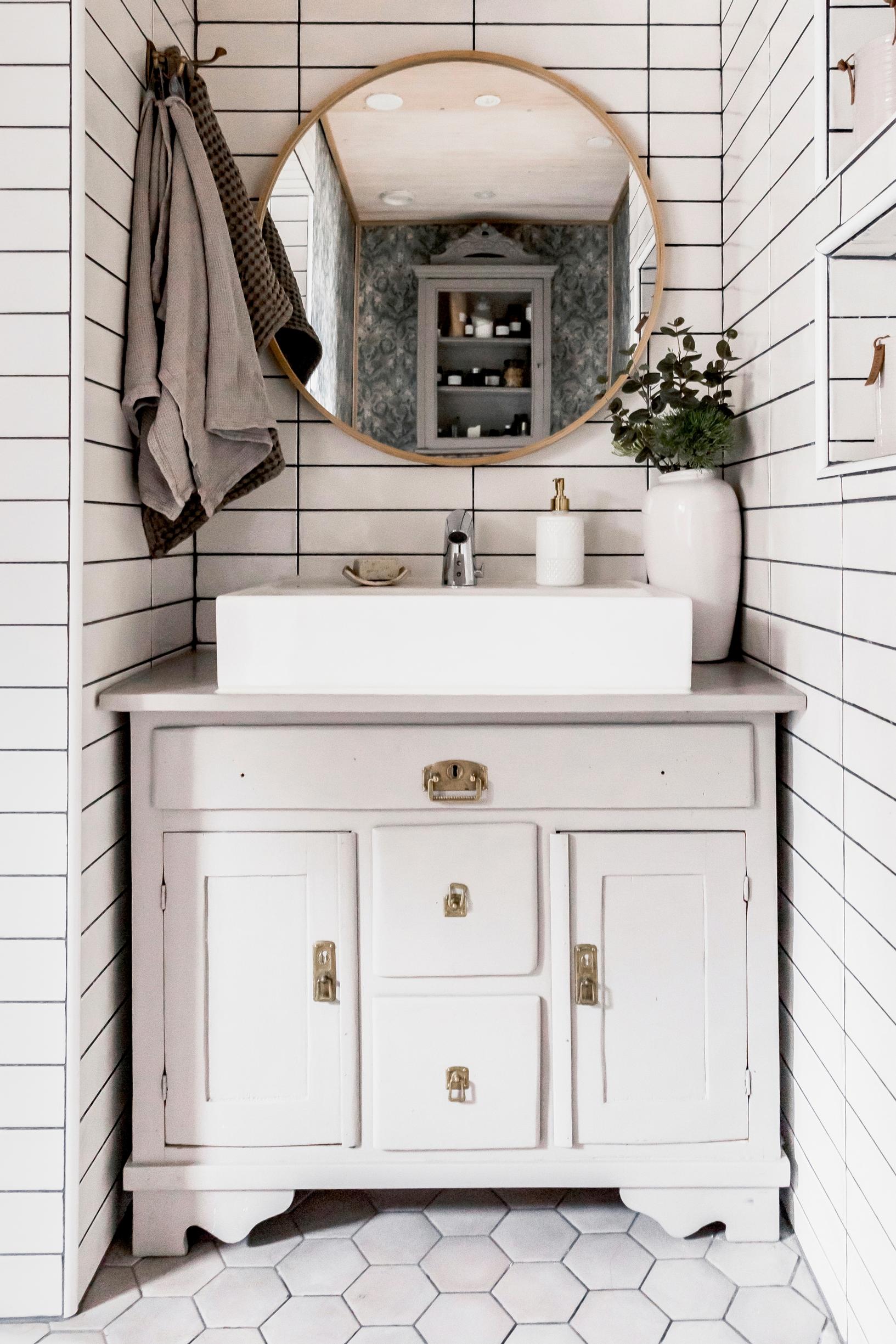 a dresser repurposed as a vanity