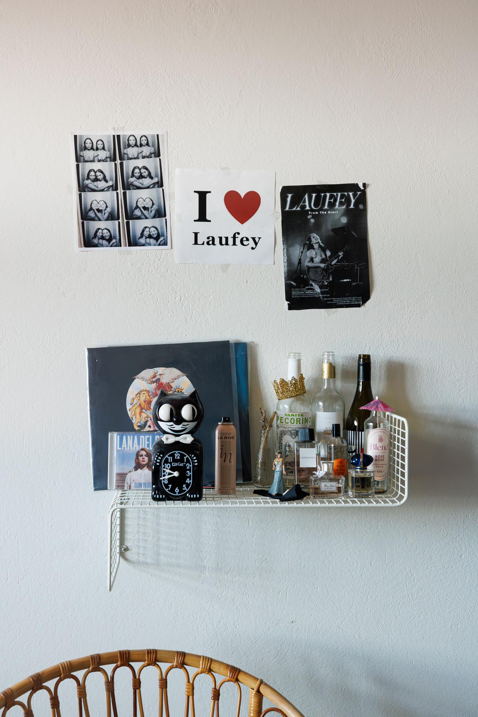 a shelf on the bedroom wall