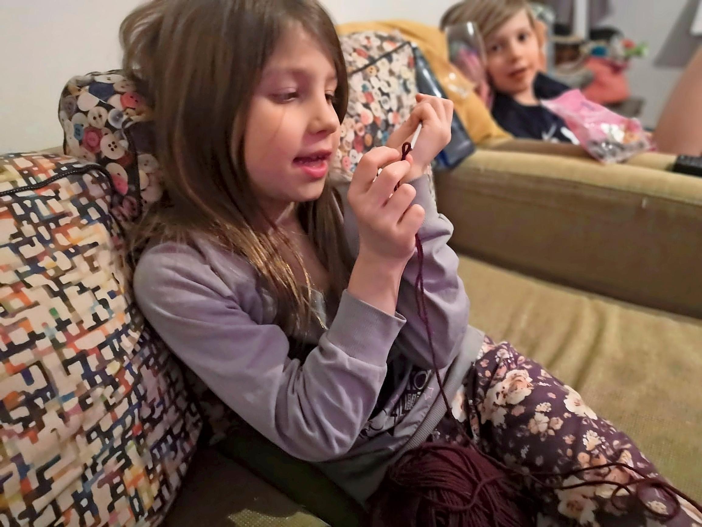 Justiina crocheting.