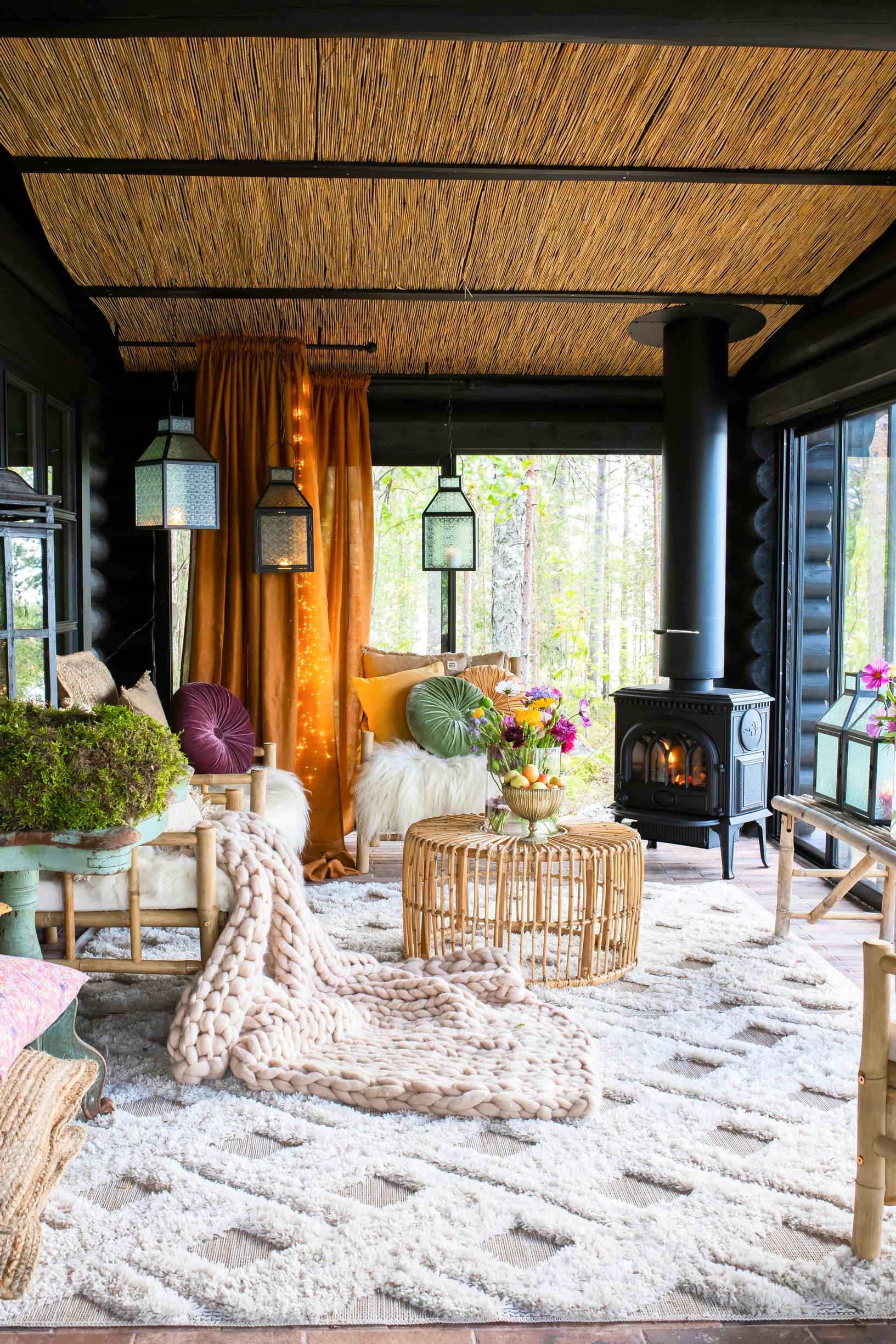 Glazed porch of a round-log cabin