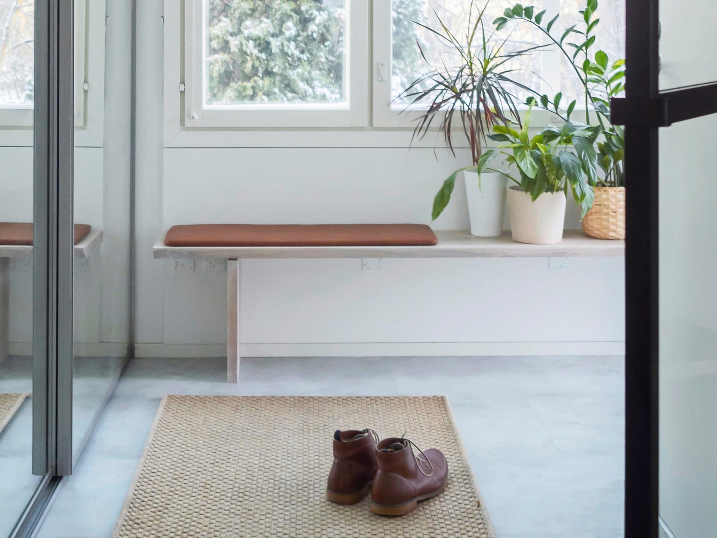 More surface space and seating for your entryway—build a wall-mounted bench with our step-by-step guide