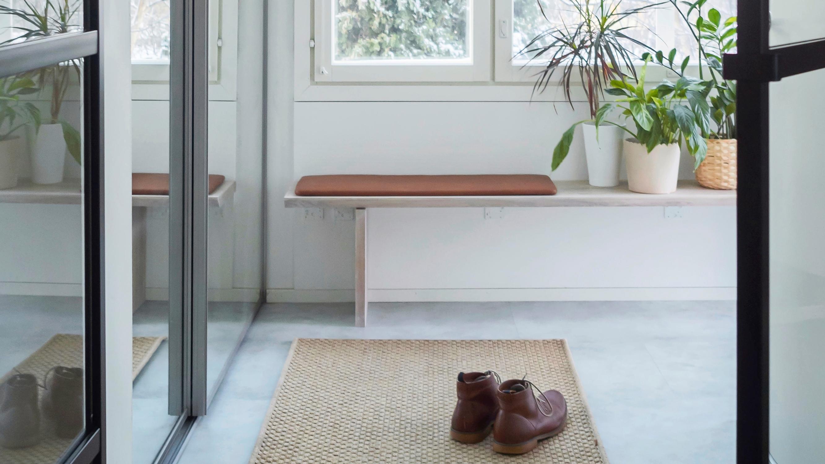 More surface space and seating for your entryway—build a wall-mounted bench with our step-by-step guide
