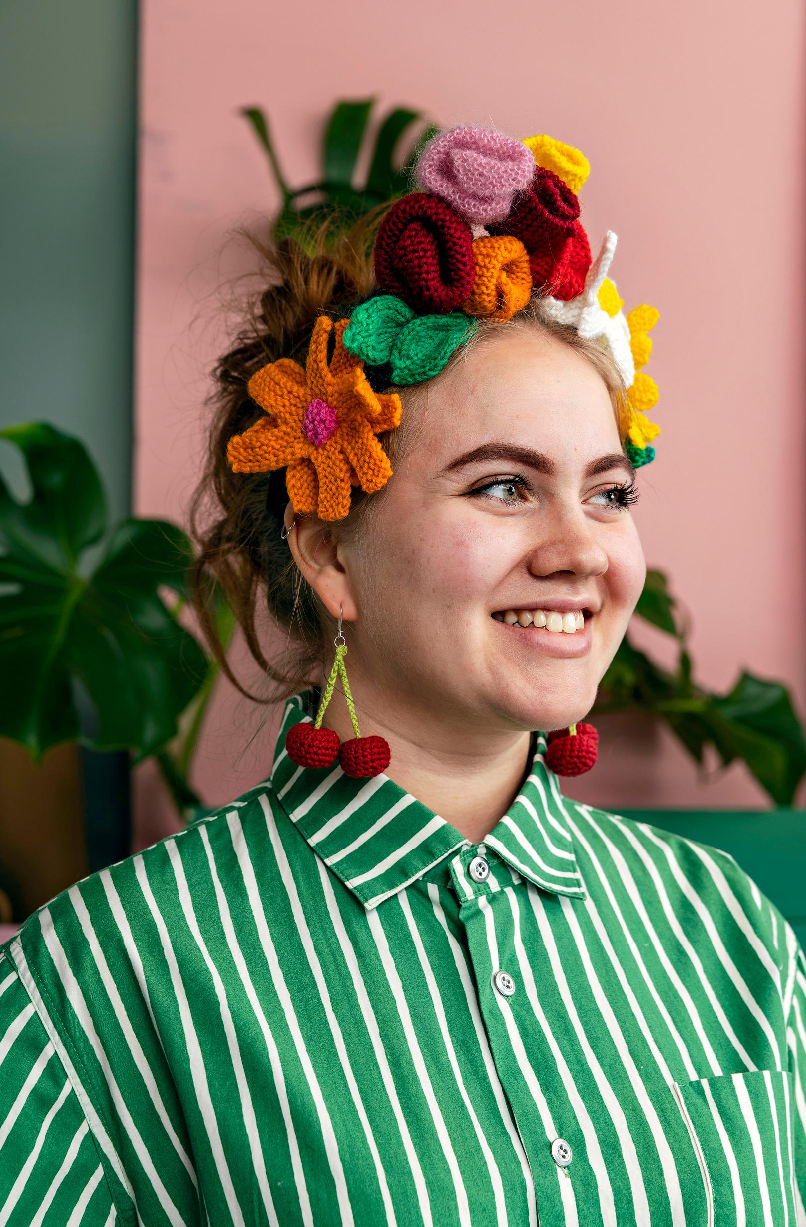 Crocheted cherry earrings and a knitted flower headband