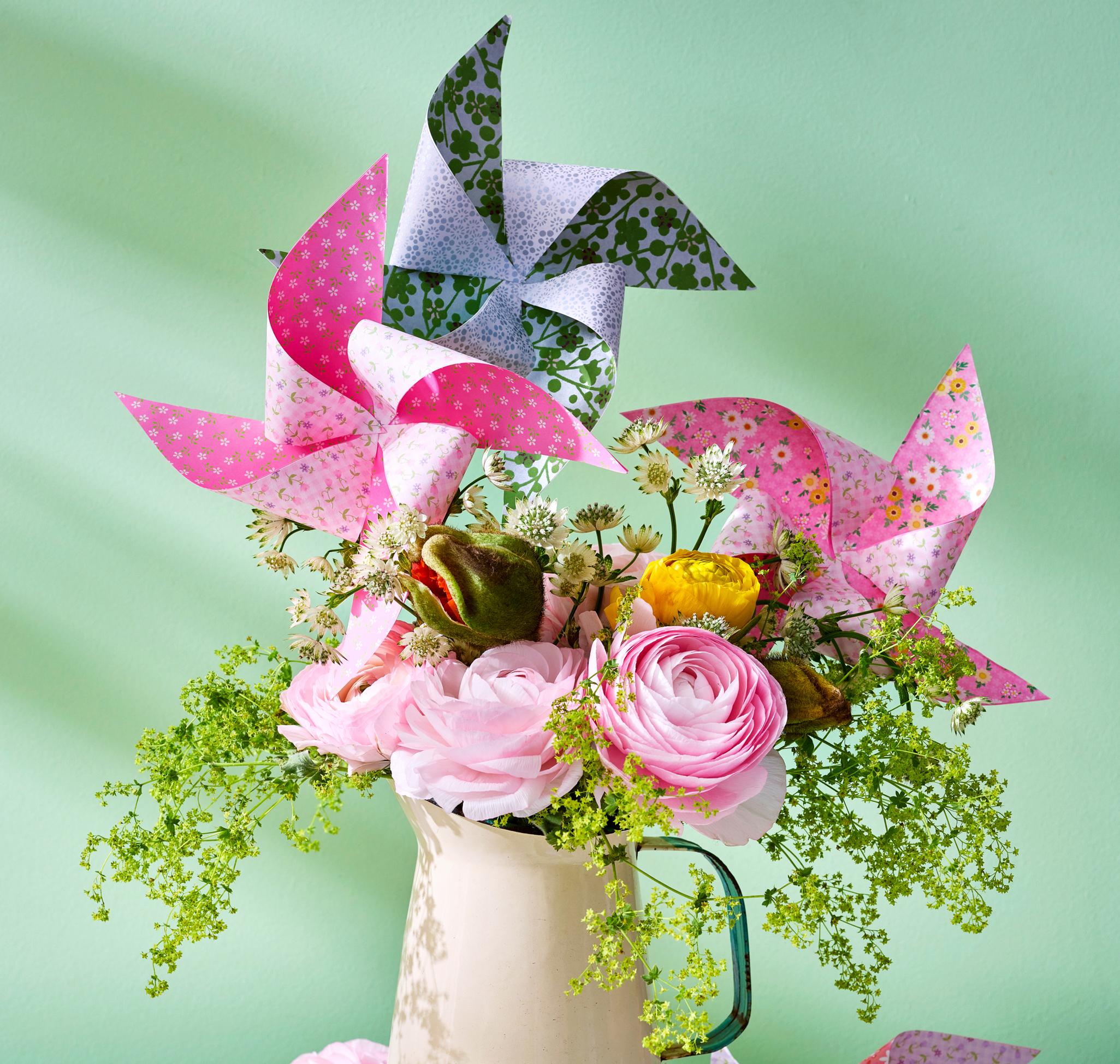 How to make a paper pinwheel from colourful paper—see our easy instructions