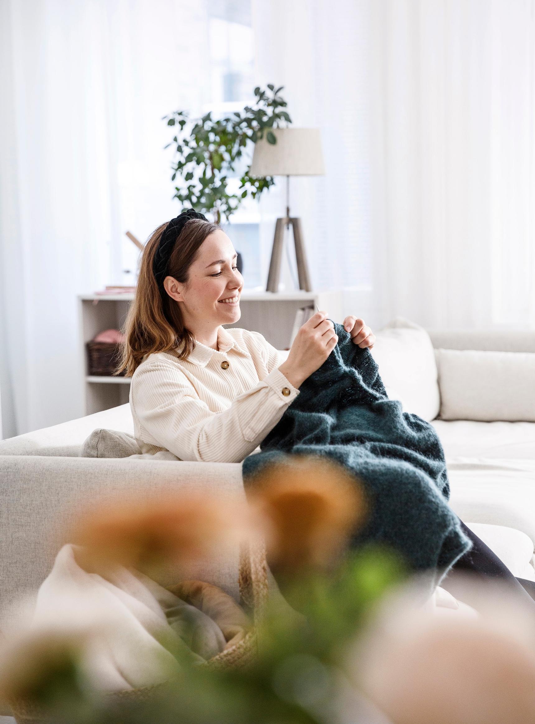 Anna knitting at home.