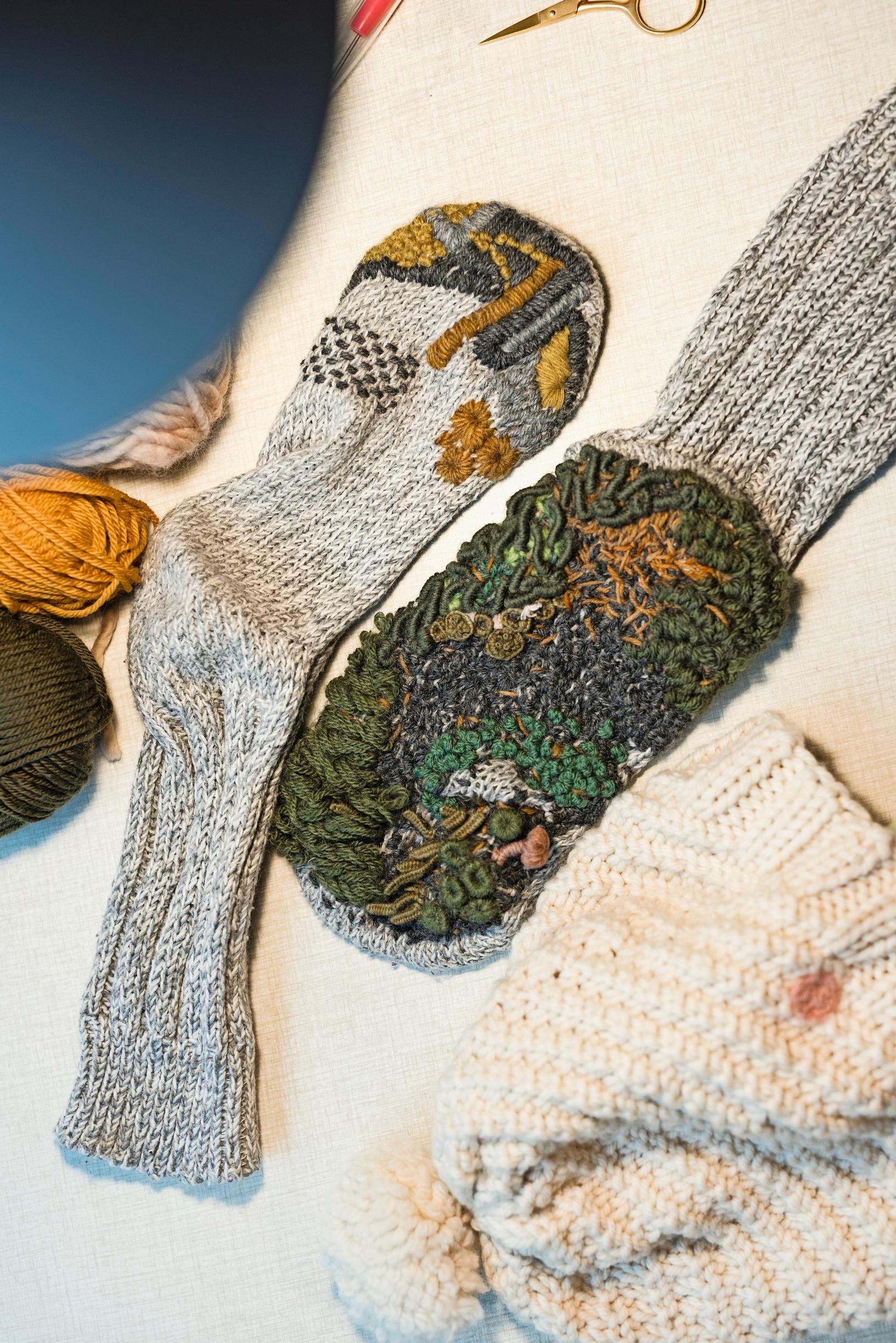A wool sock sole repaired with moss embroidery,