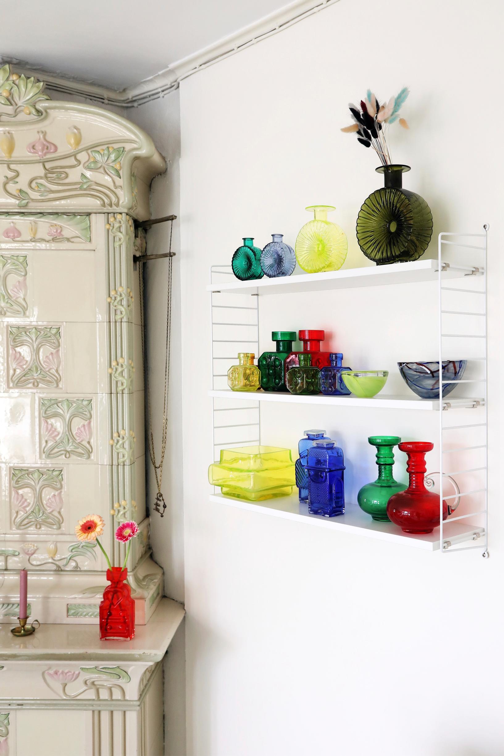 The String shelf is a great place for a collection of colorful vintage glassware.