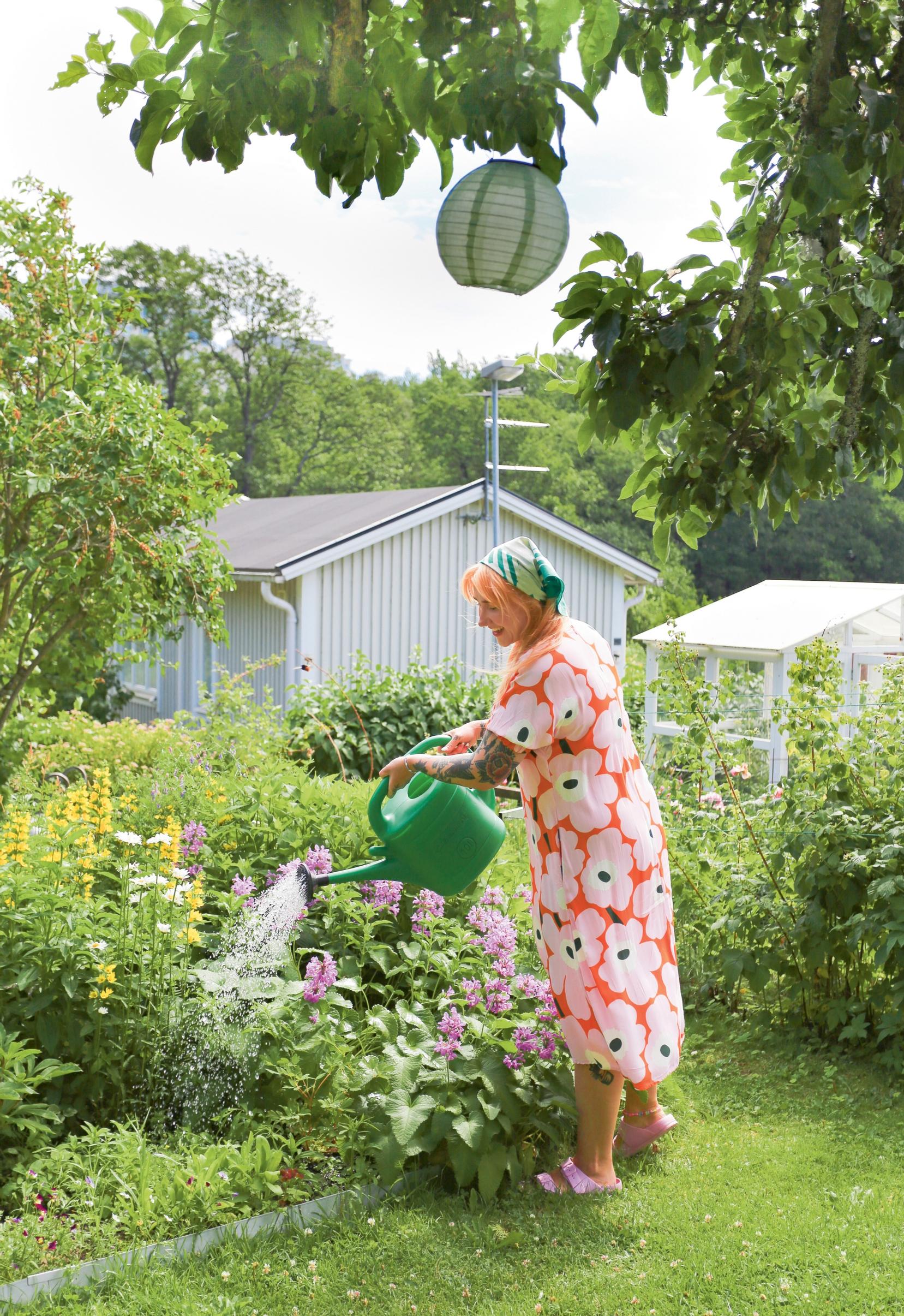 Hanna Paananen watering flowers