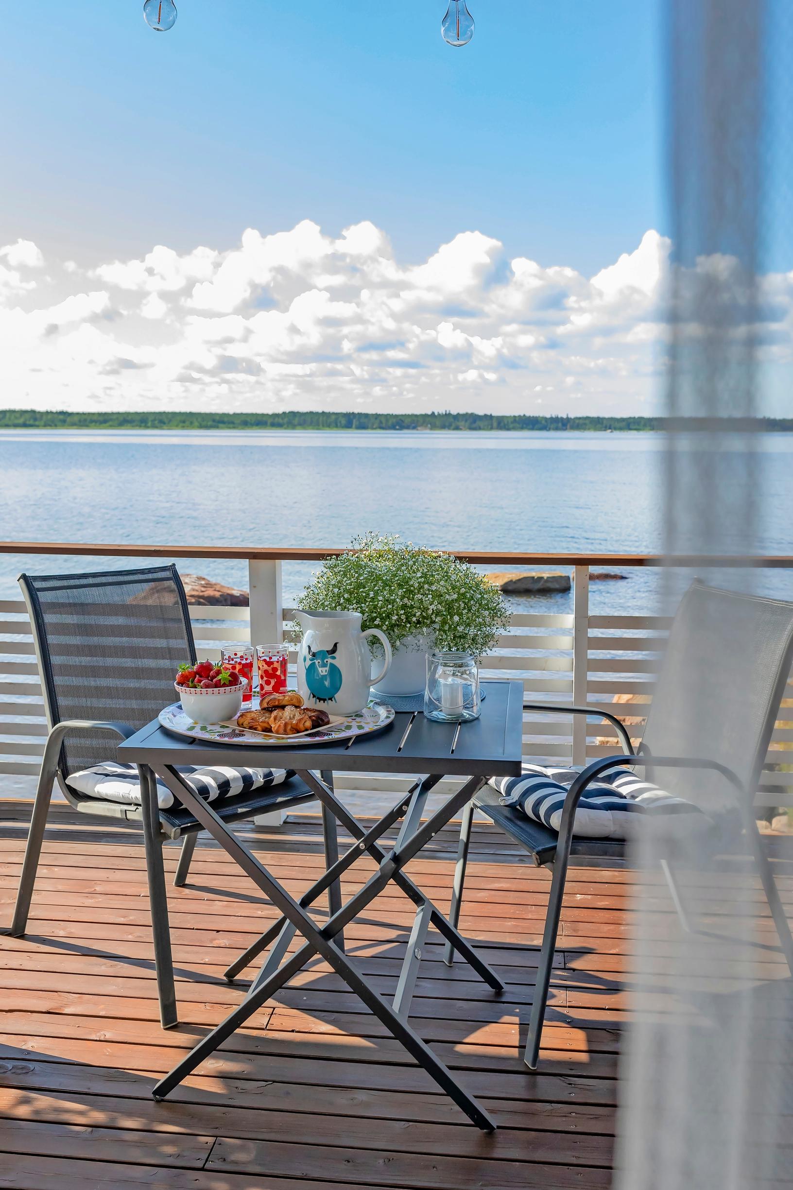 synthetic rattan furniture on the terrace and a sea view