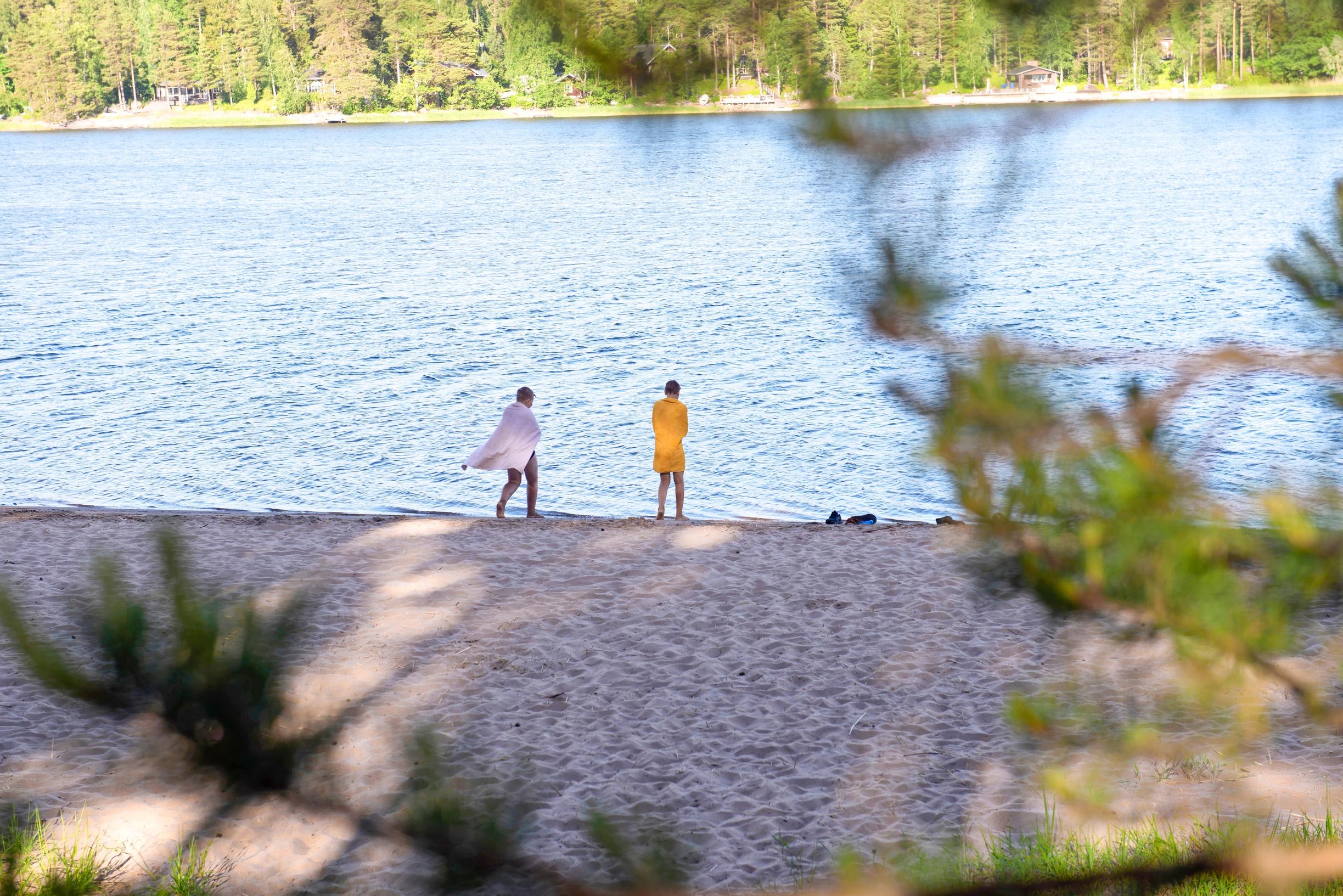 two boys seen from behind on a beach
