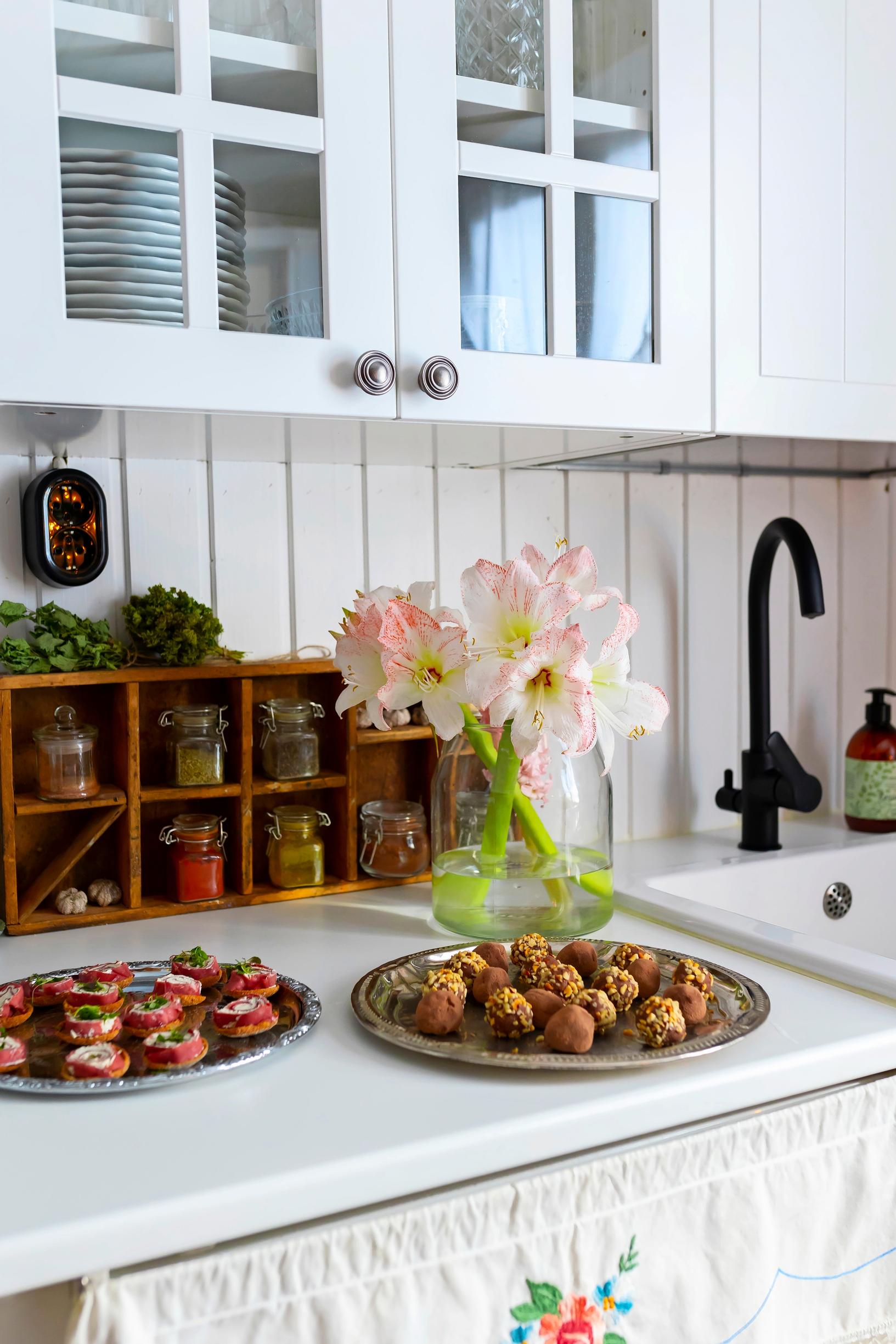 Smoked reindeer rolls and truffles on the kitchen counter