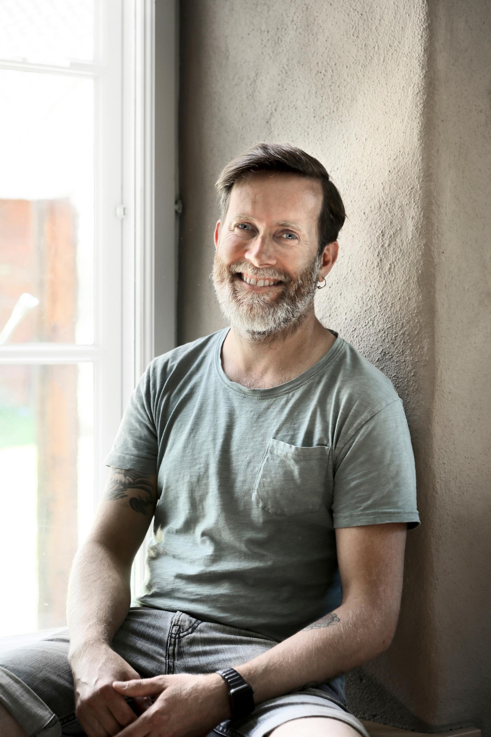 Jonathan Hemming sitting by the window