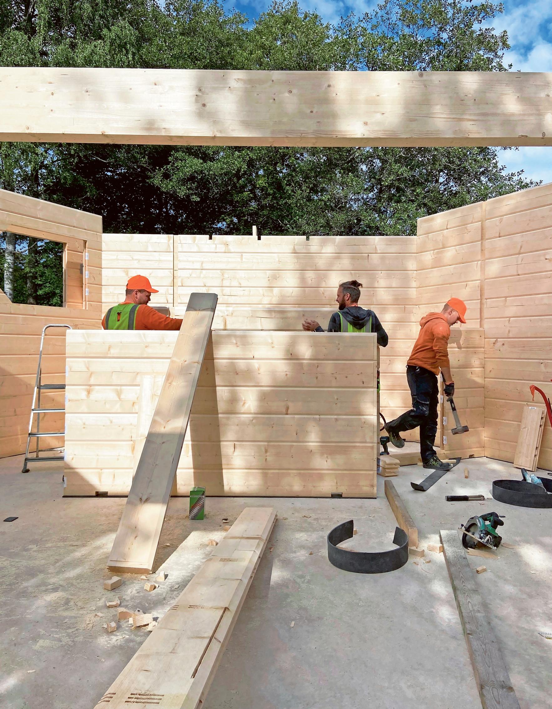 The Kuusi-o house frame being assembled