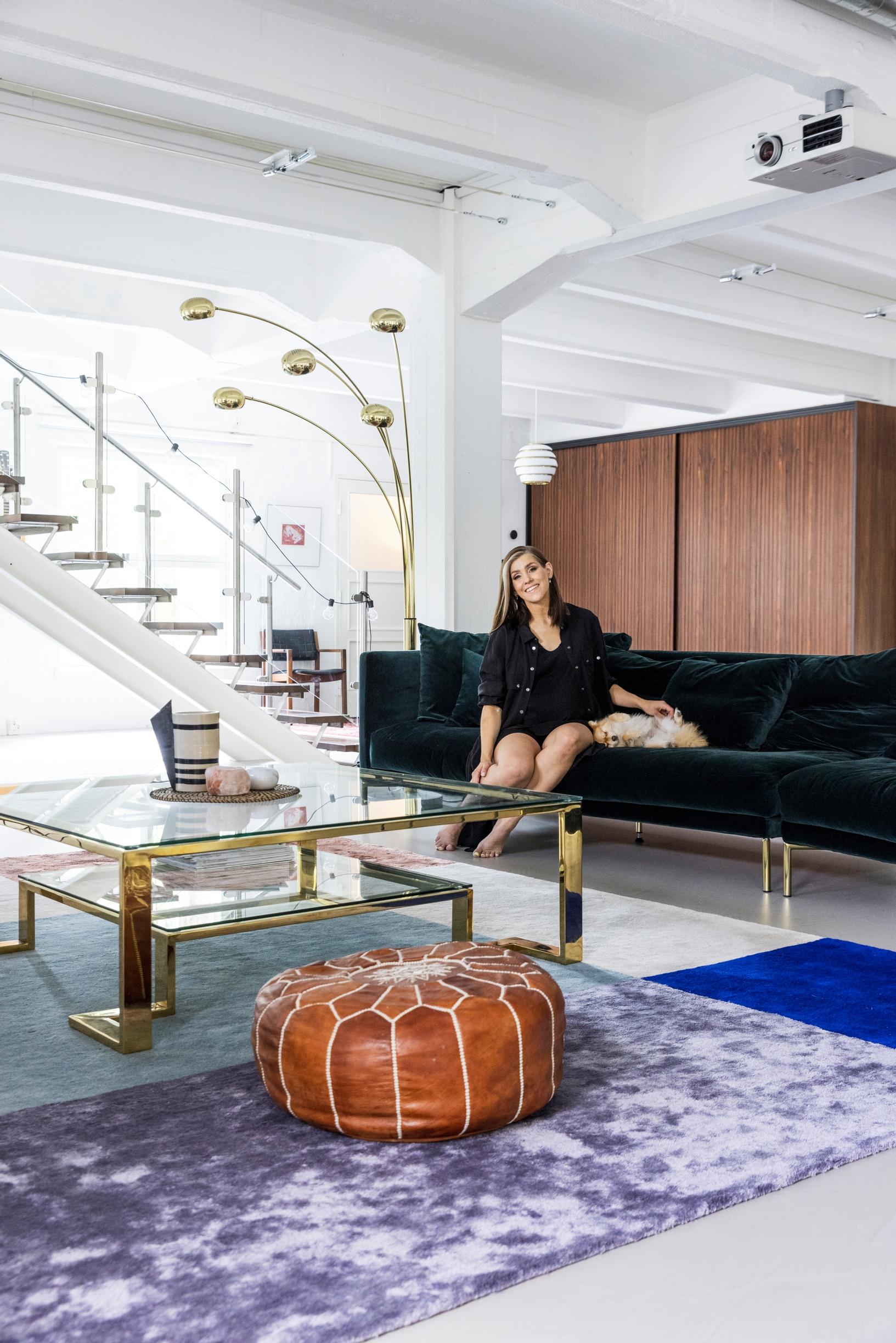 Inside the stunning transformation of Jannika B and Toni Wirtanen’s loft home—the kitchen got a blue-green shade and the exposed walls reveal the building’s history