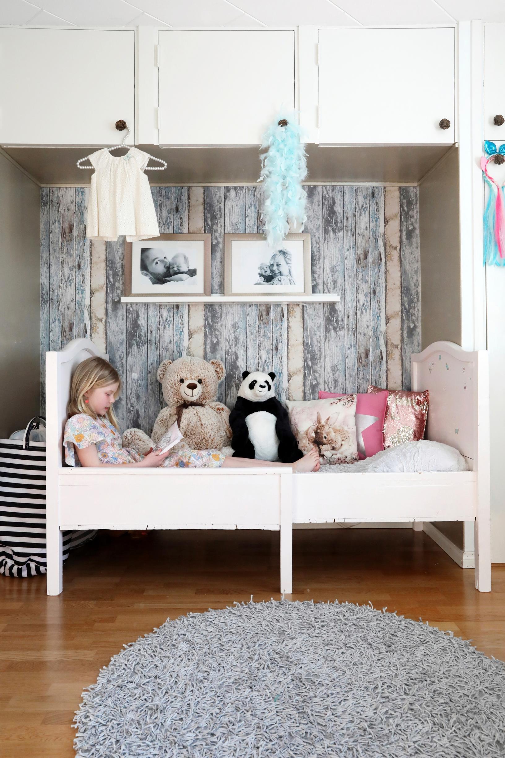 A child’s extendable wooden bed.