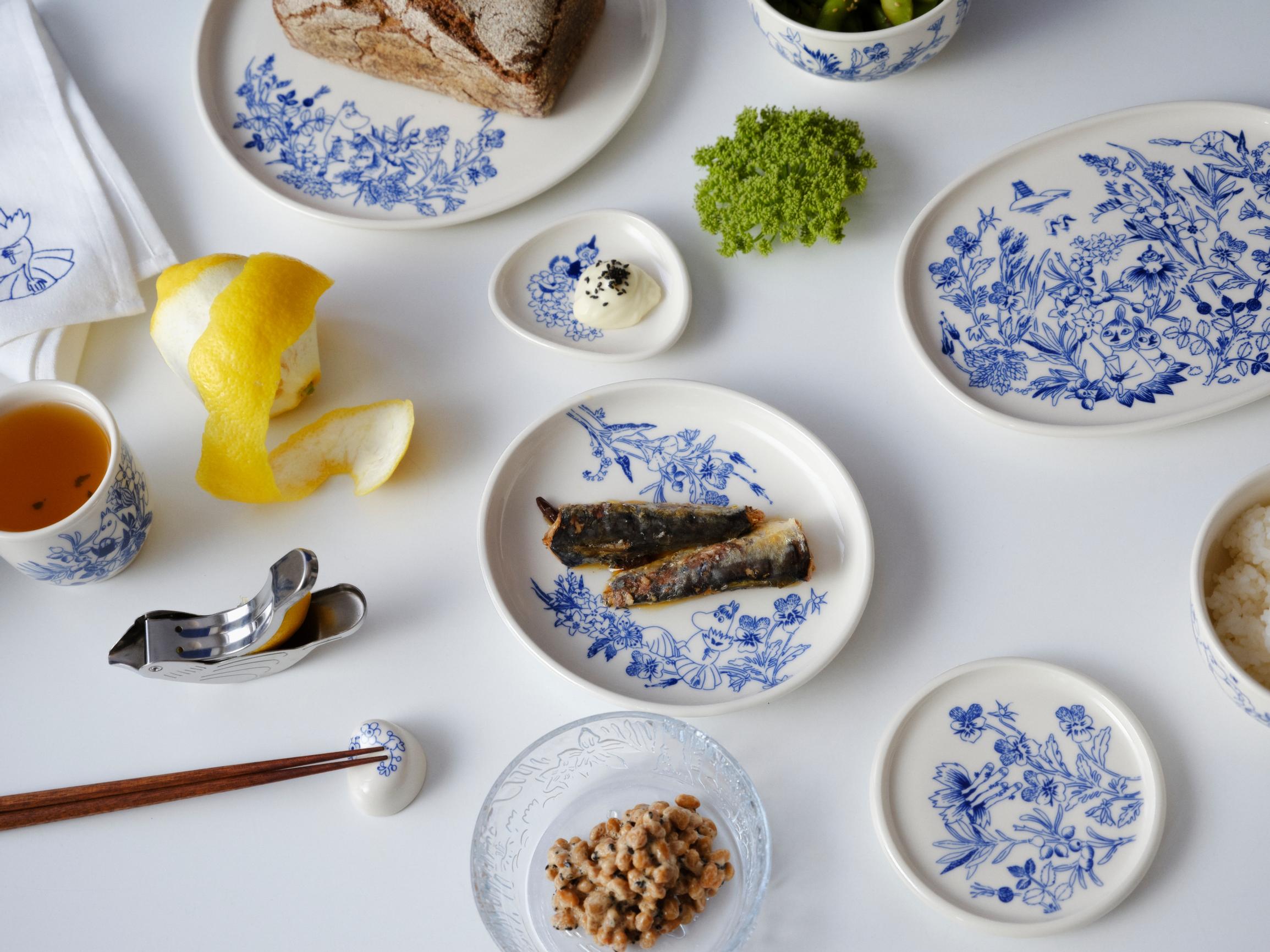 Dishes from Arabia’s Haru collection on a table, with food in them and a lemon
