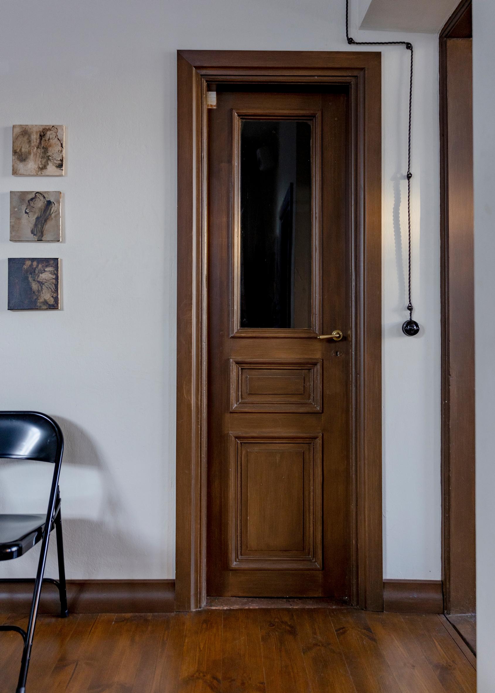 A narrow, decorative wooden cabinet door