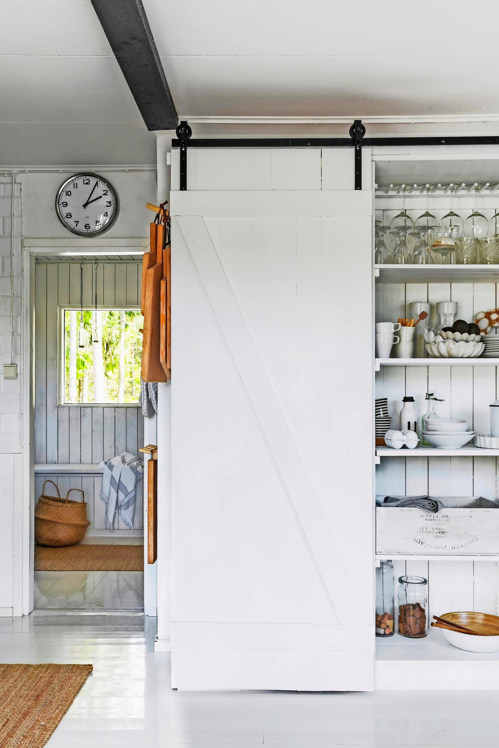 A tall breakfast cabinet with a sliding door