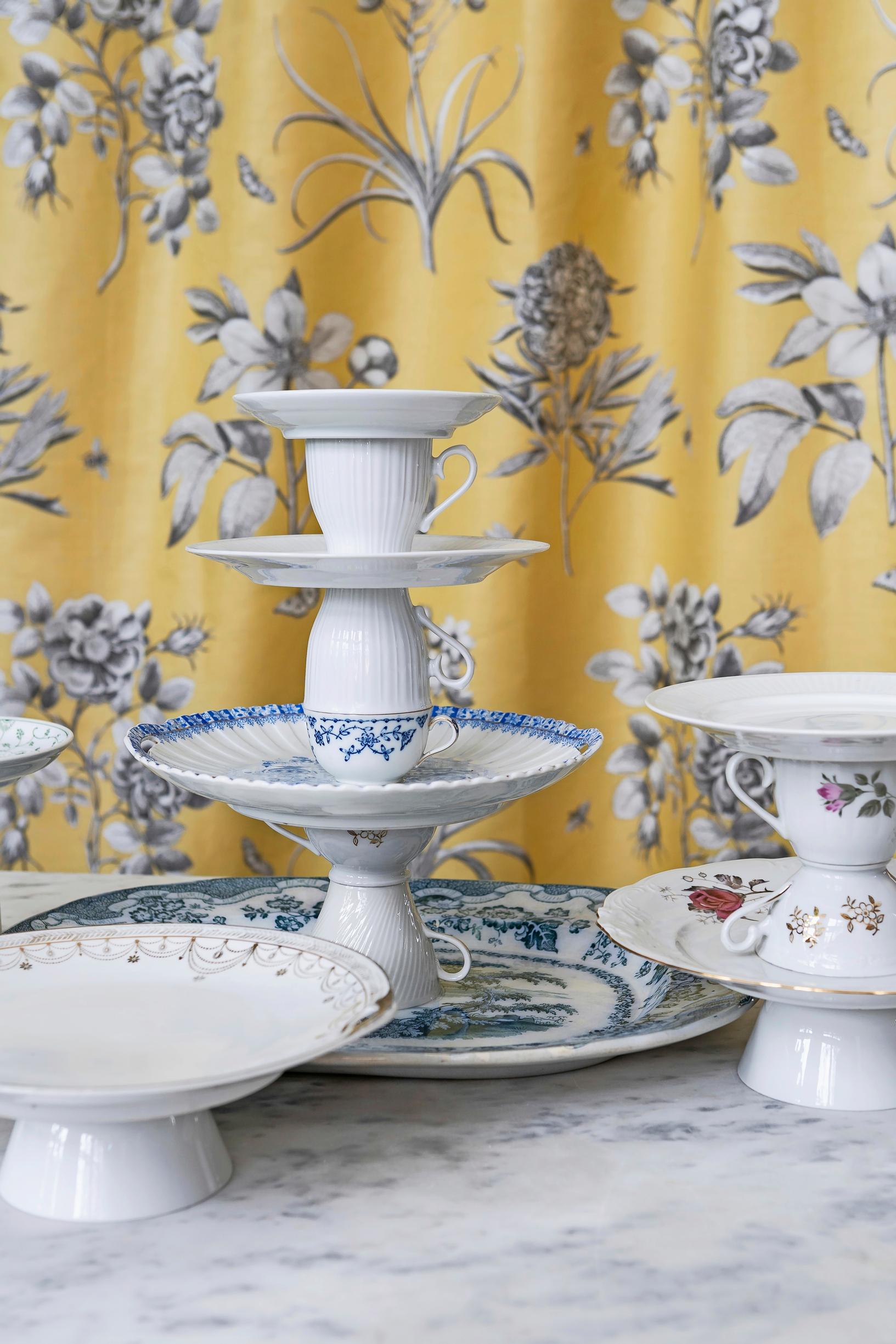 Photo of old dishes assembled into tiered serving stands.