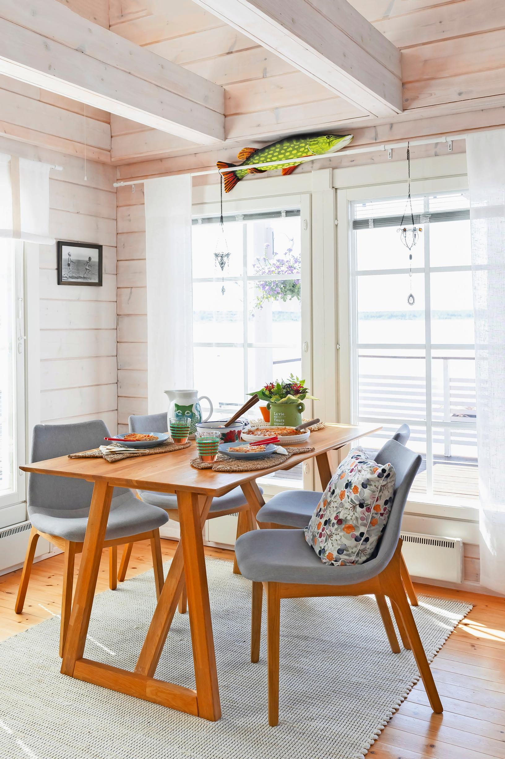 a dining set and windows, plus a pike-themed cushion