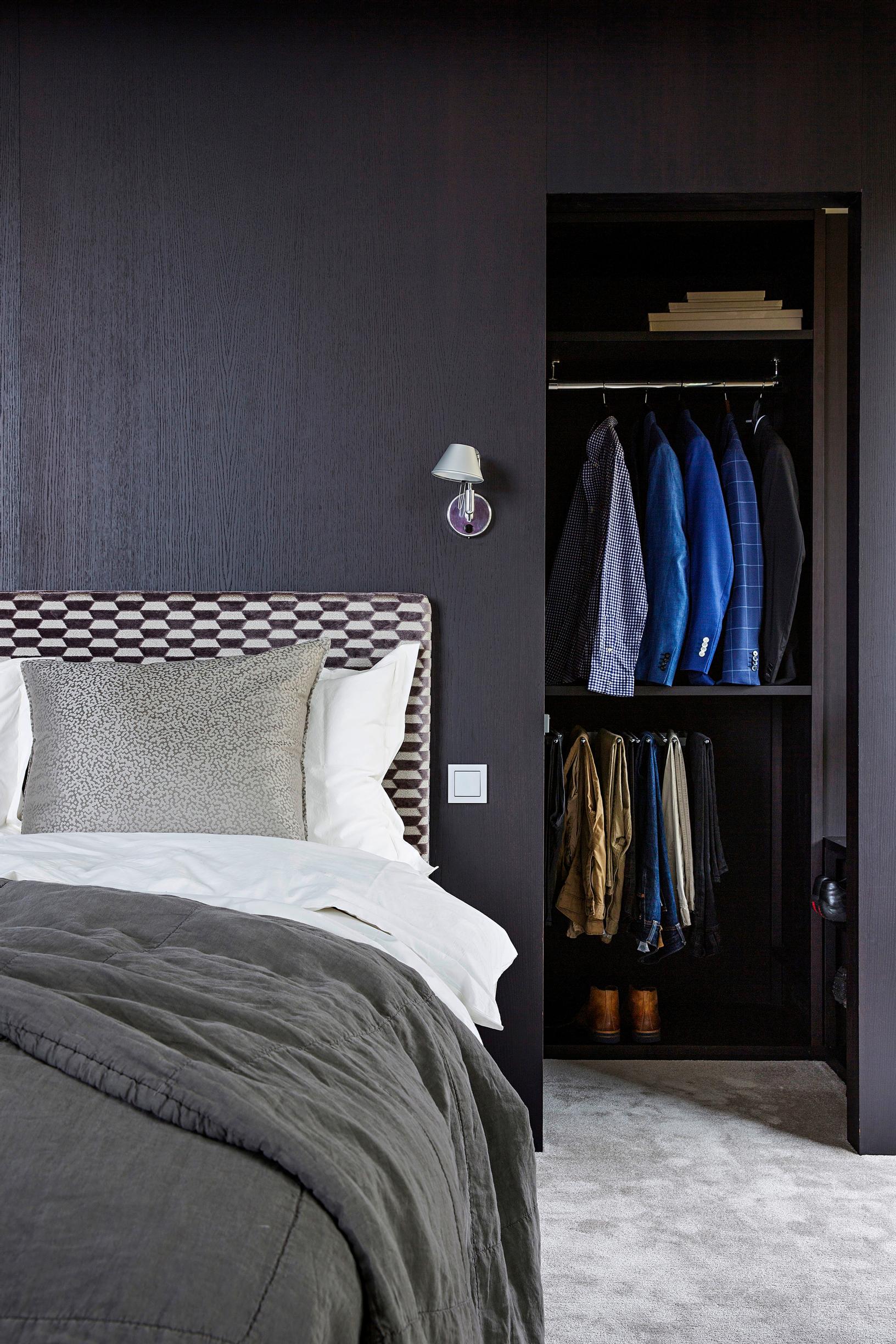 Walk-in closet behind the bed