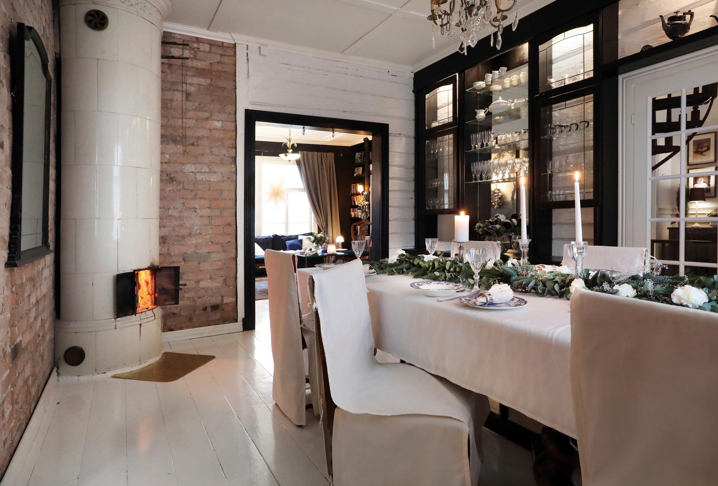 The old riding estate’s spacious dining area with a cylindrical stove in the corner