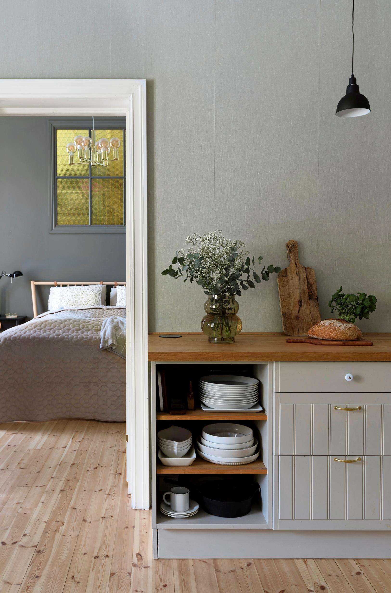 A view from the kitchen into the bedroom.