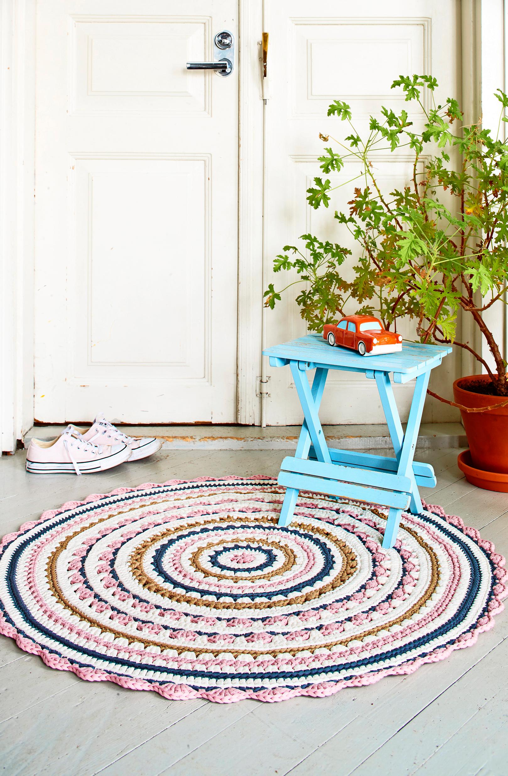 Crocheted round rug—a T-shirt-yarn mat that brings cozy character to any space