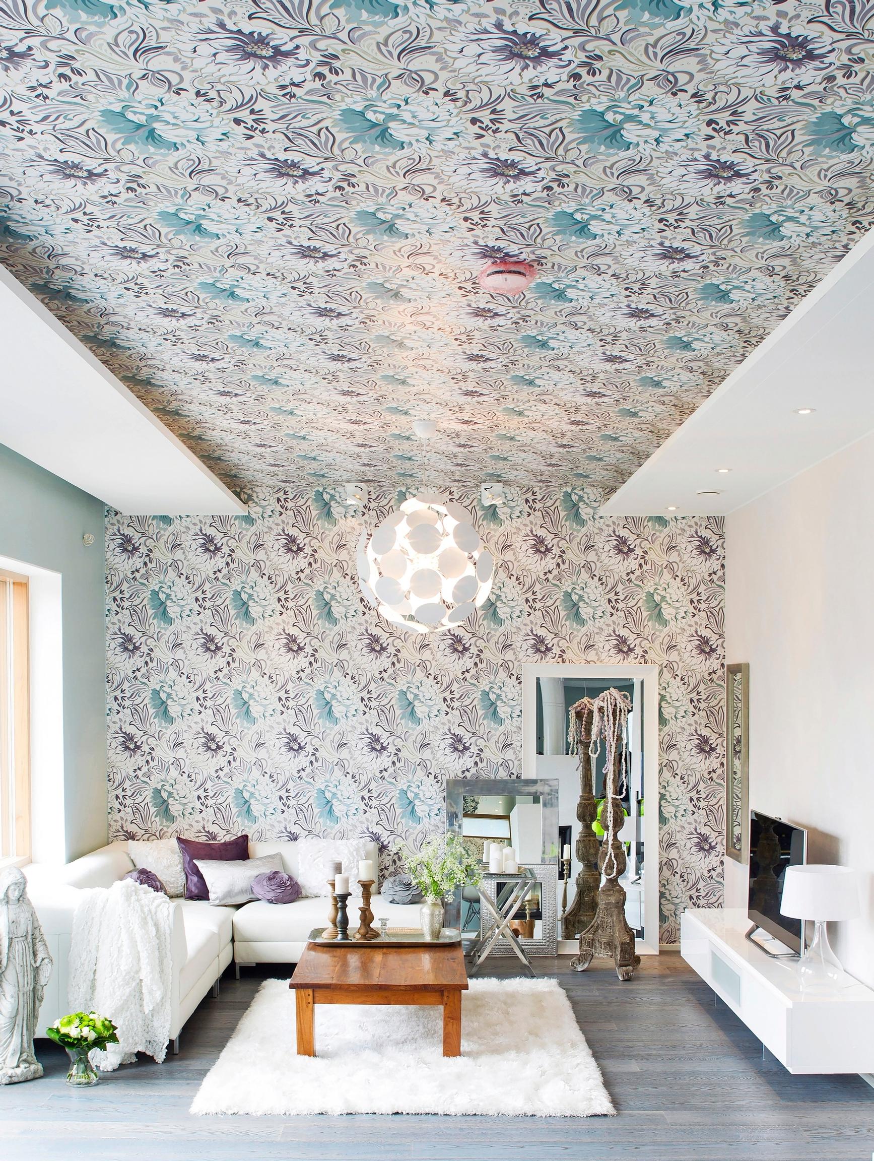 Ceiling covered with rose-patterned wallpaper