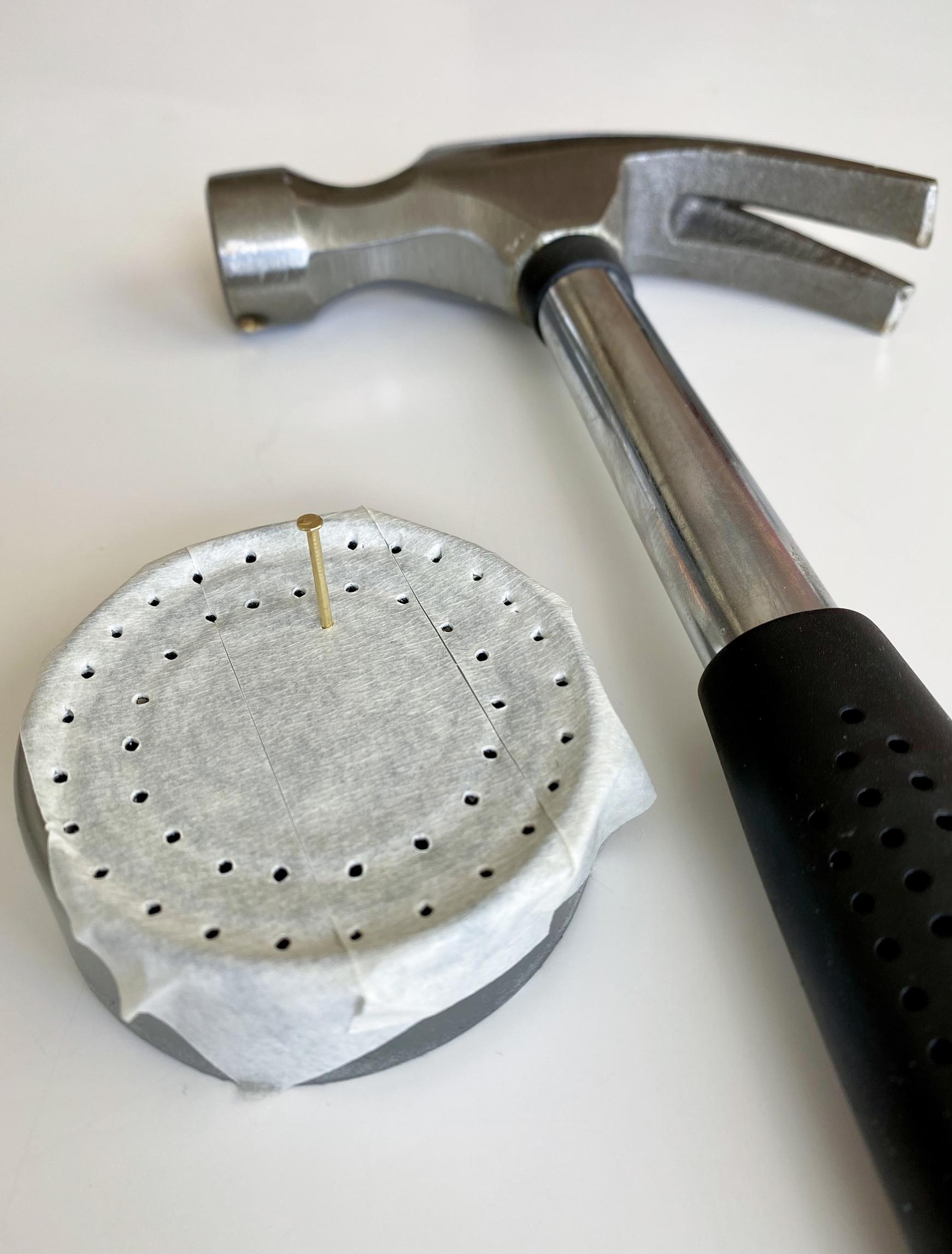 Hammering holes into the pin frog’s base