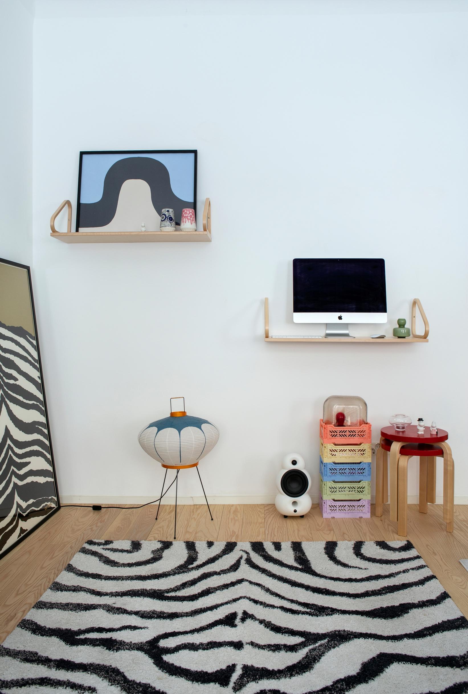 A computer on an Artek wall shelf