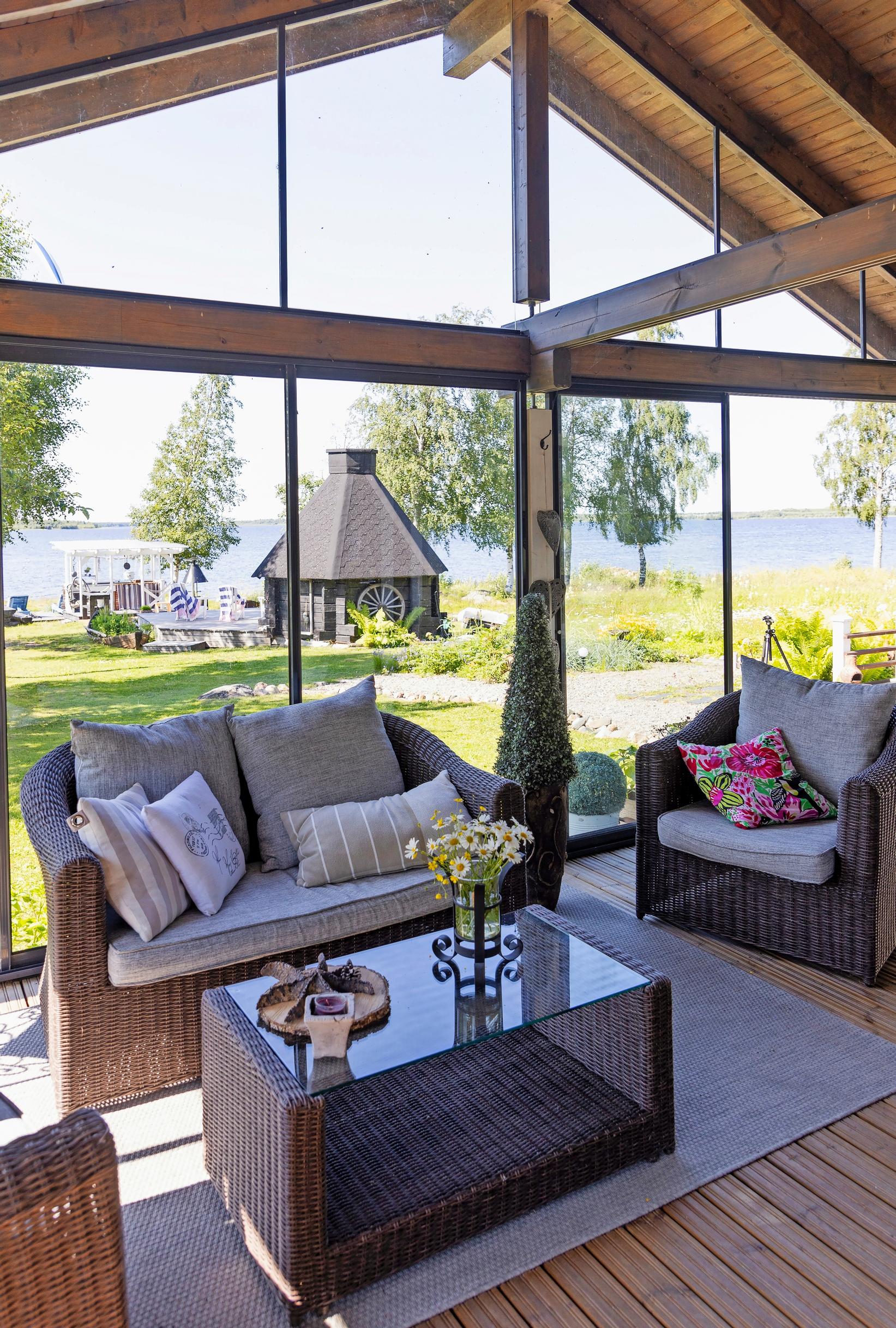 The living room of Marita and Eki's island cottage and a view of the sea