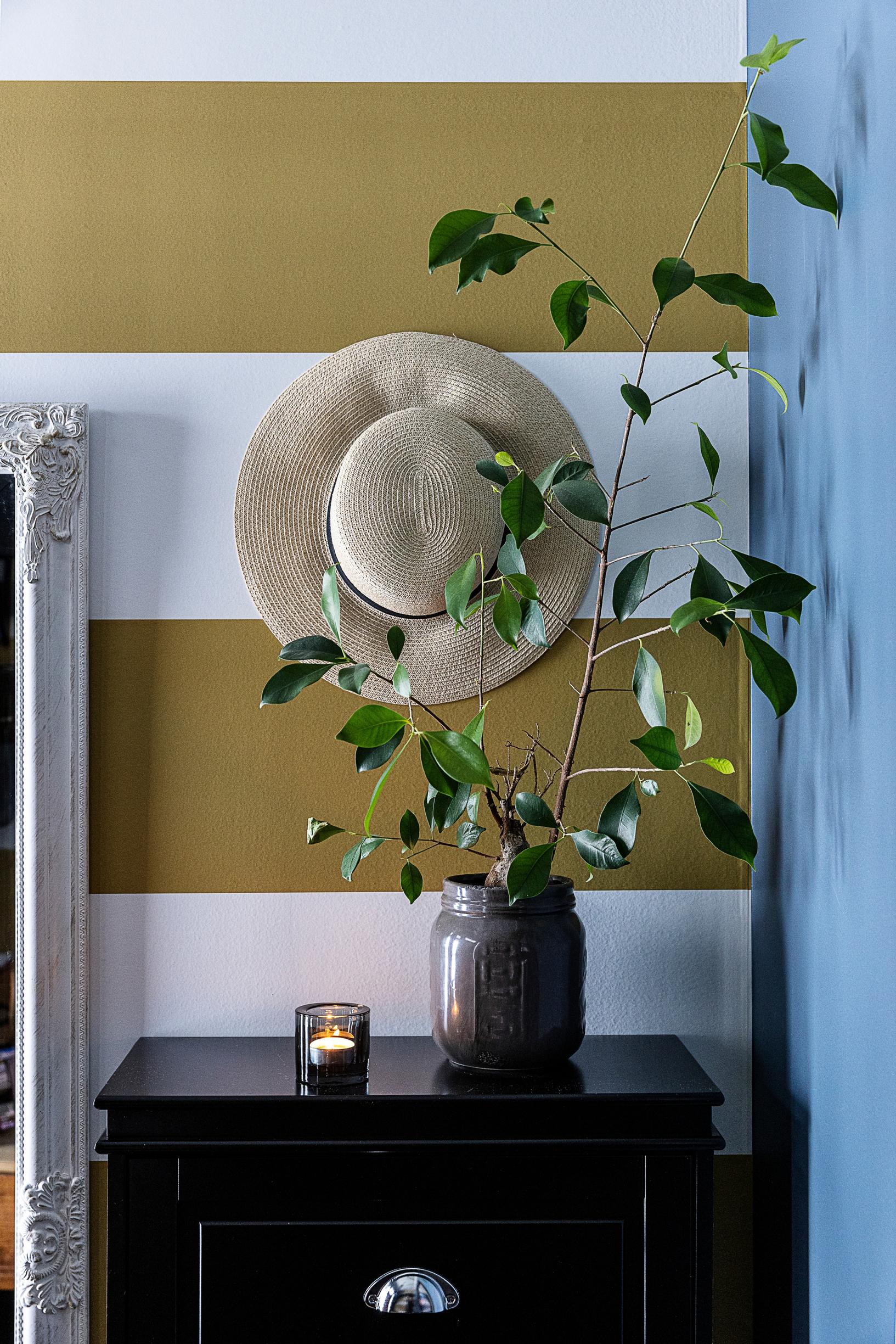 The entryway’s striped wallpaper.
