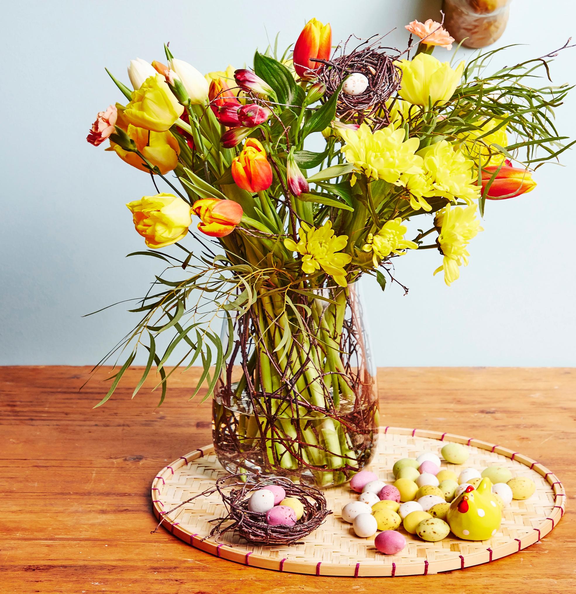 Tie the cheeriest Easter bouquet with supermarket flowers in a simple twig nest