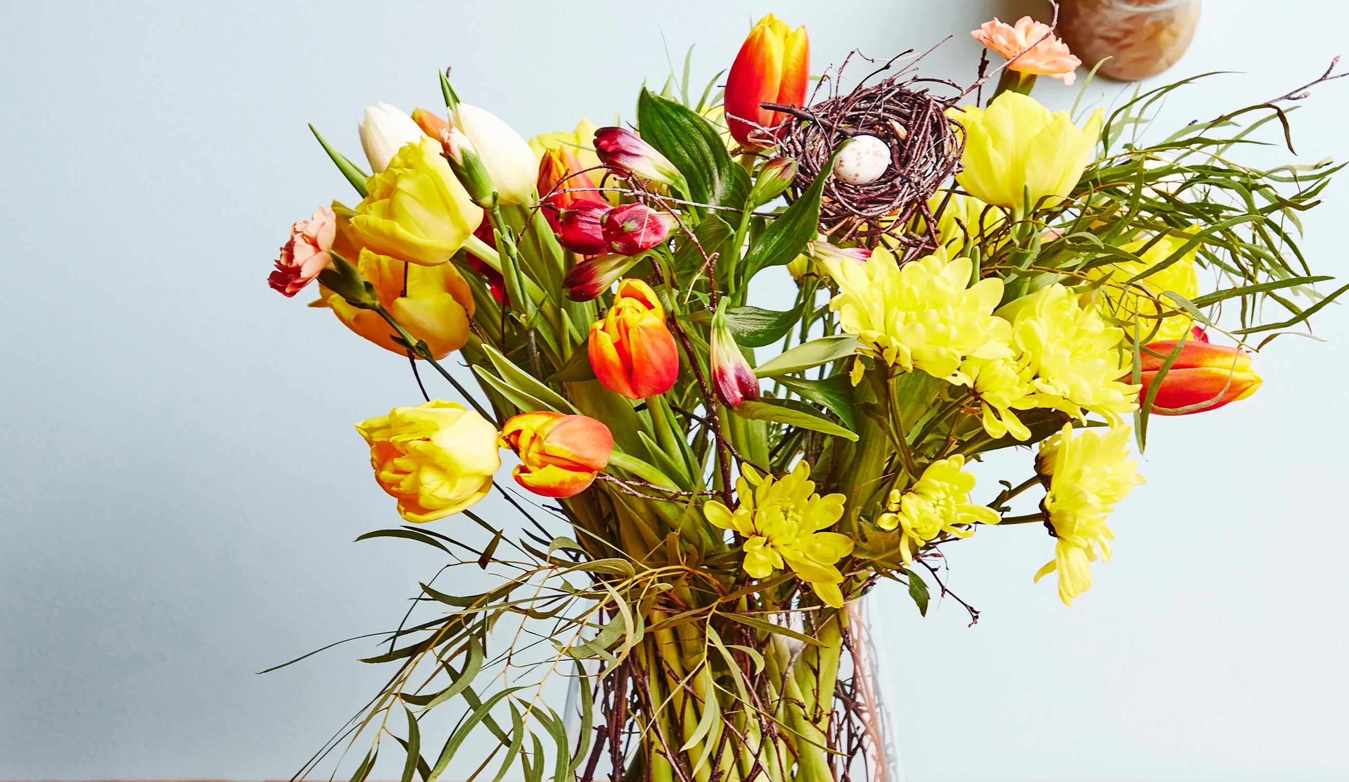 Tie the cheeriest Easter bouquet with supermarket flowers in a simple twig nest