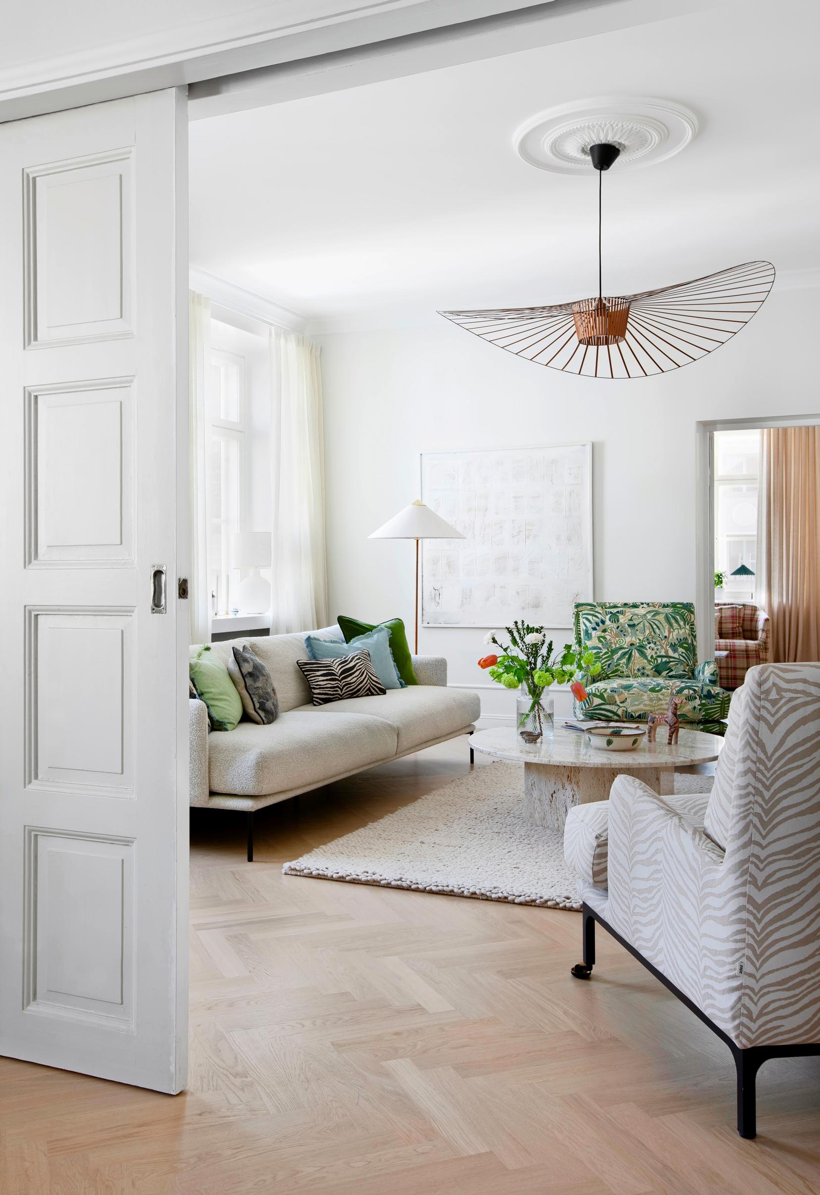 The original sliding doors separate the remote workspace from the bright living room.