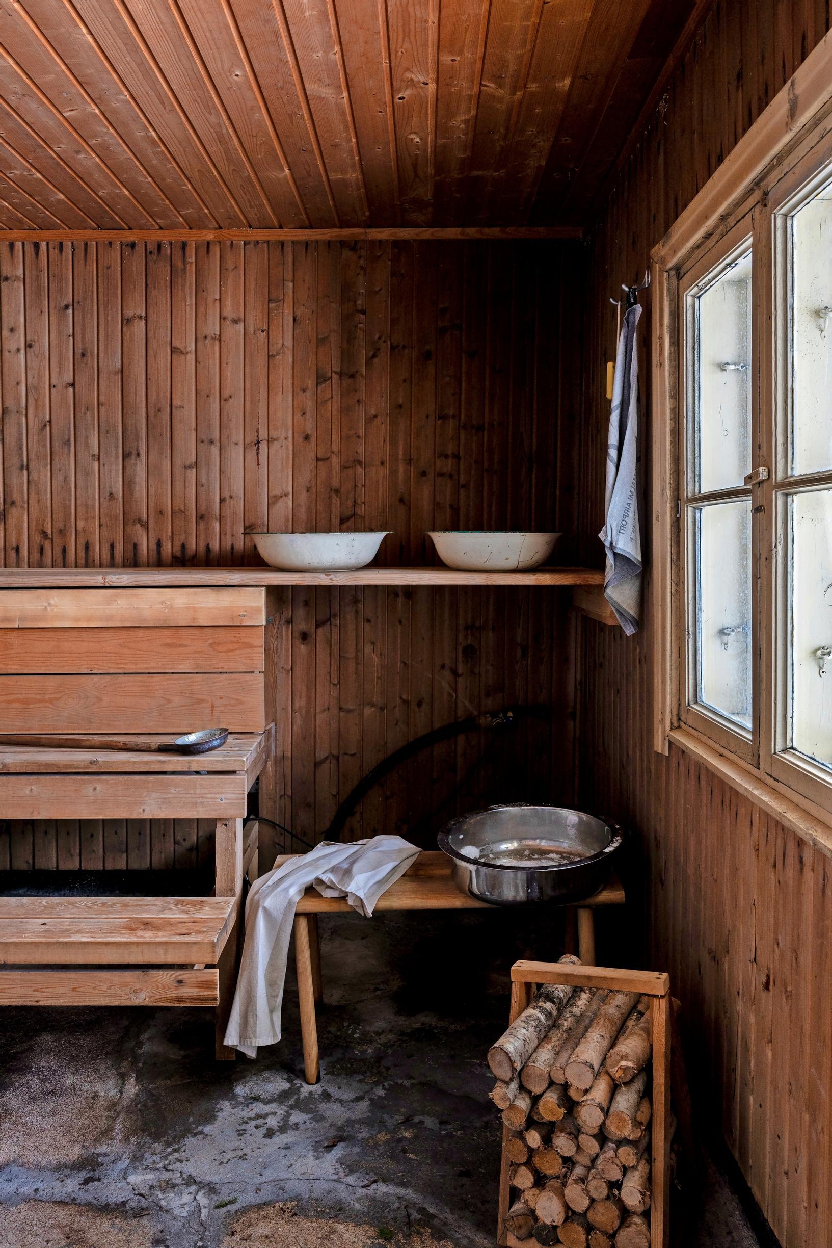 Old sauna benches, log carrier, and wash basins