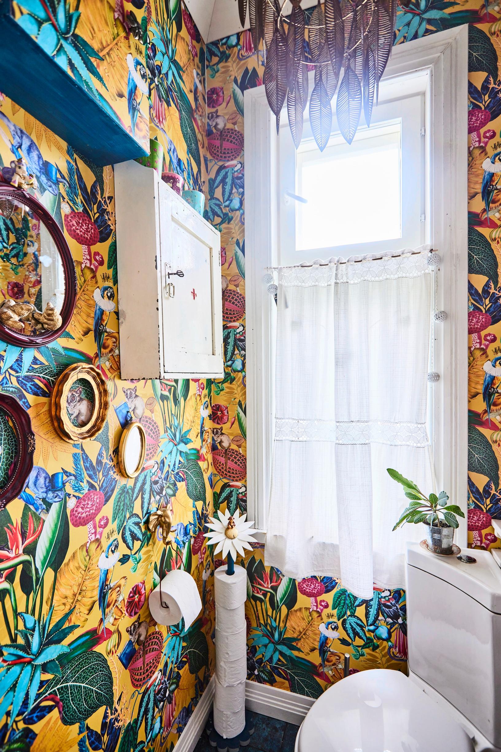 Small WC with colorful wallpaper